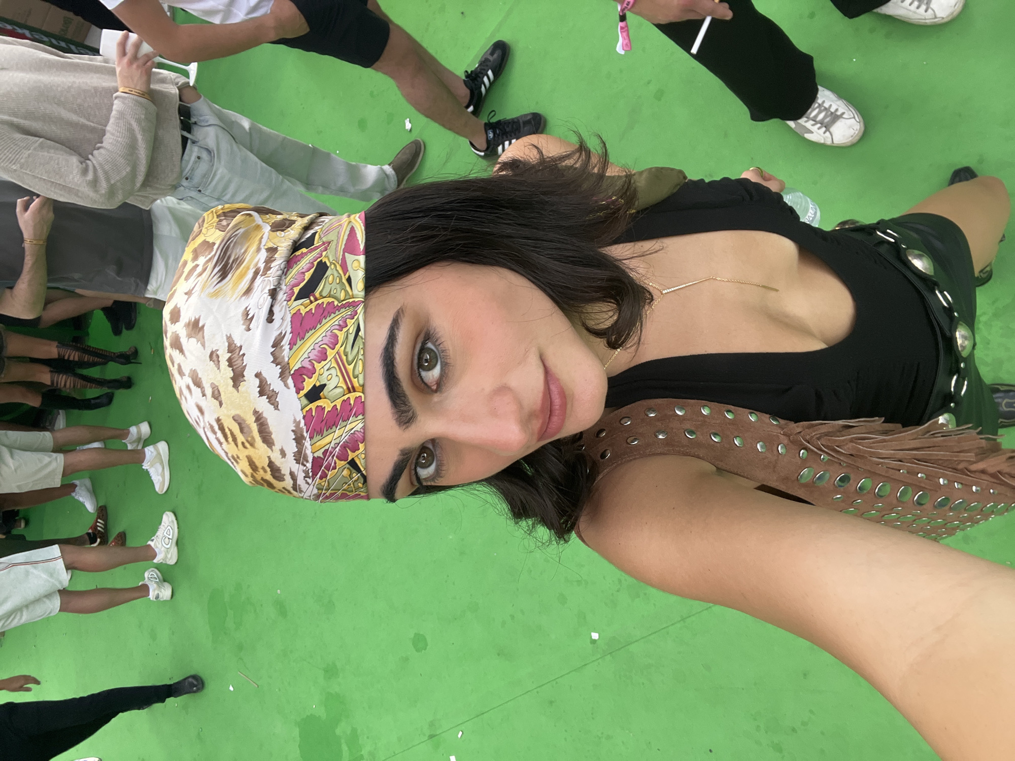Woman takes selfie in outdoor Madrid gathering