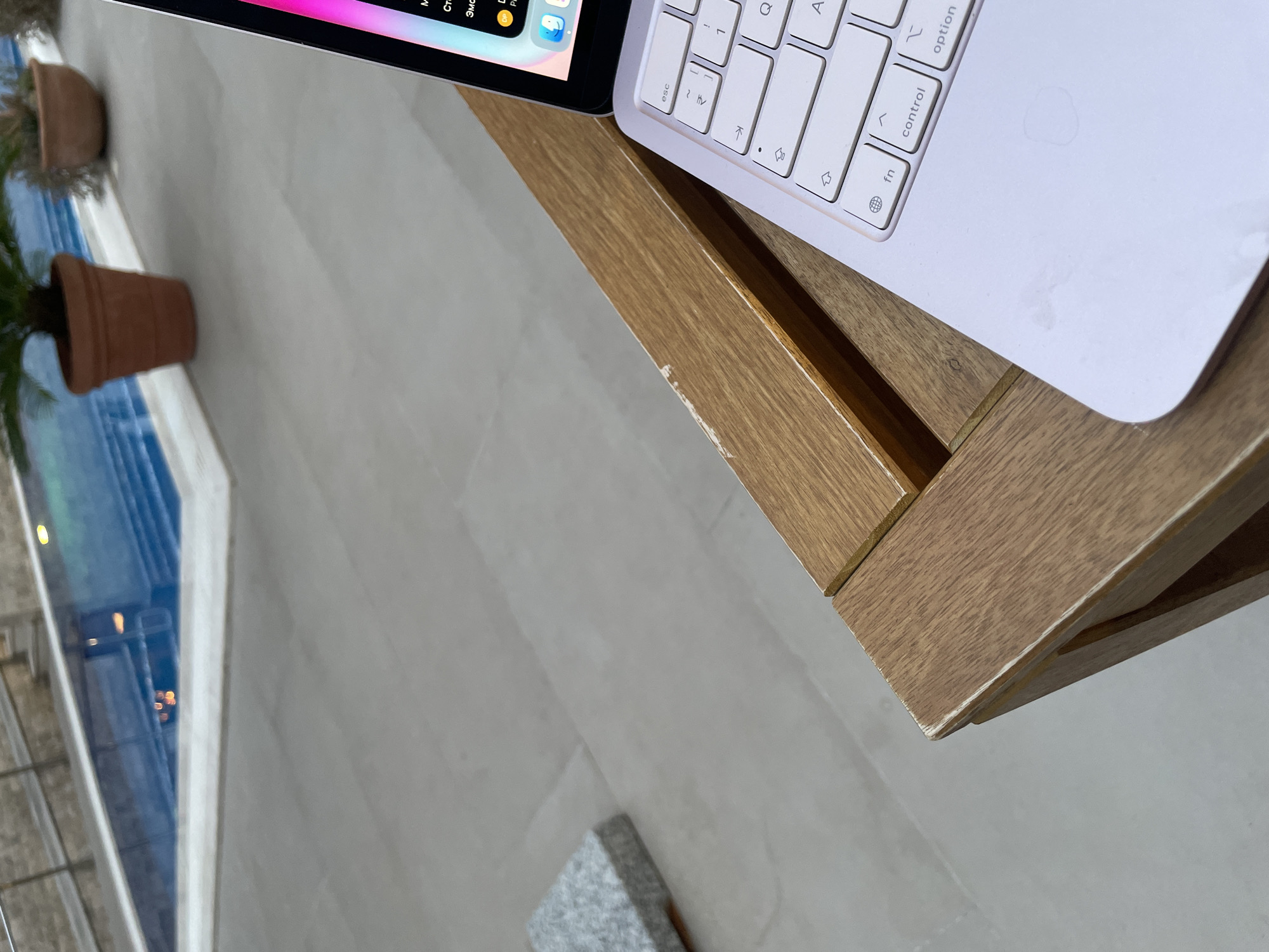 Café patron works on laptop at waterside Montenegro location