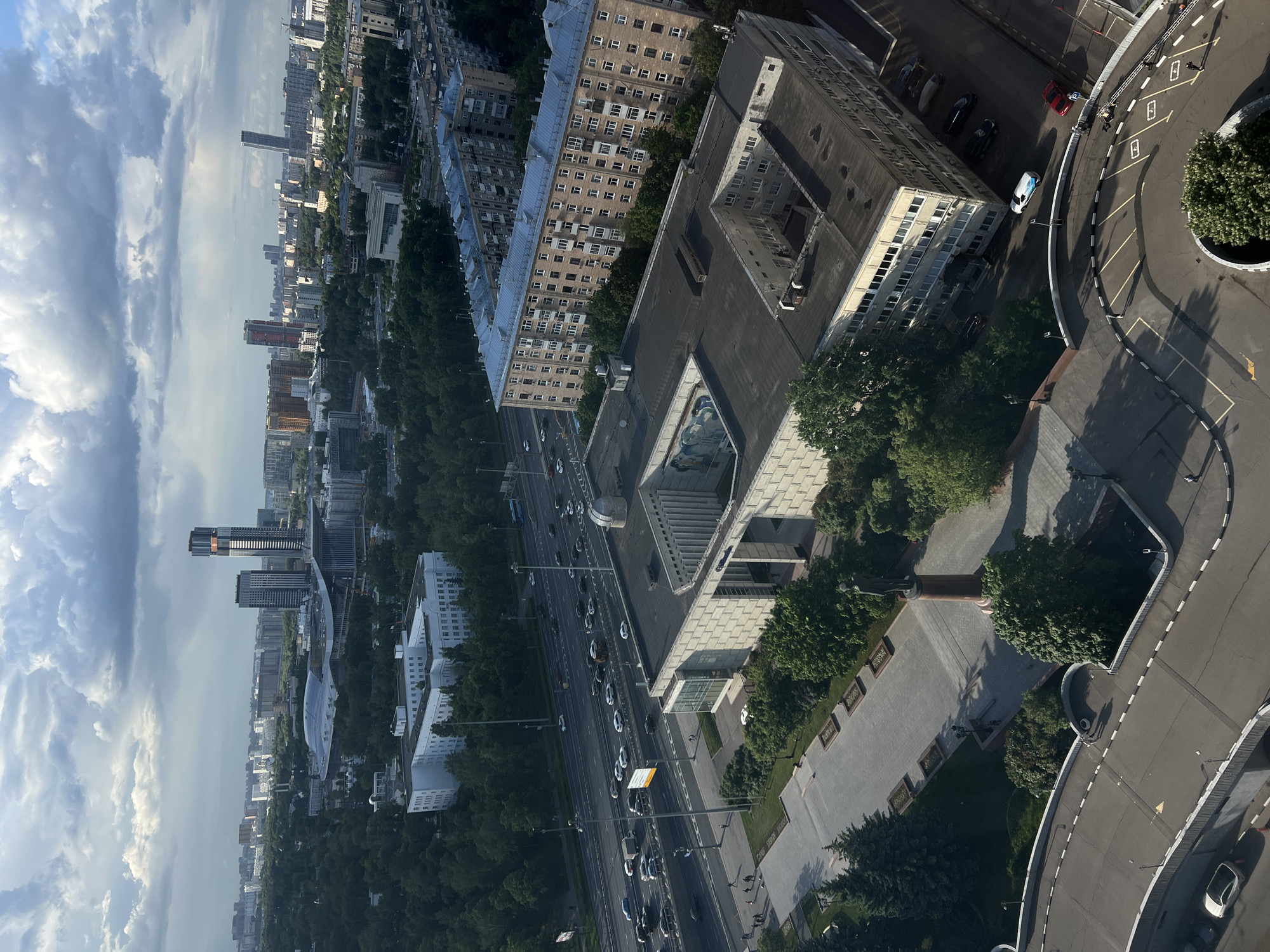 Tourist documents Moscow landmarks and infrastructure during afternoon visit
