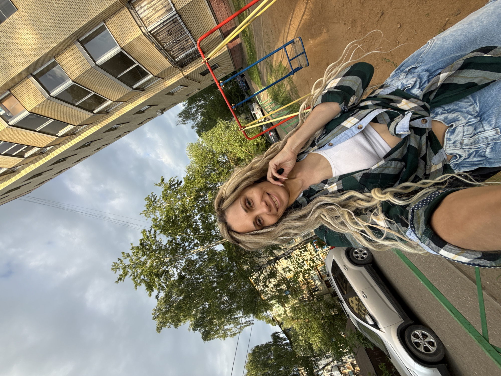 Woman poses smiling in casual attire in Rusanovo