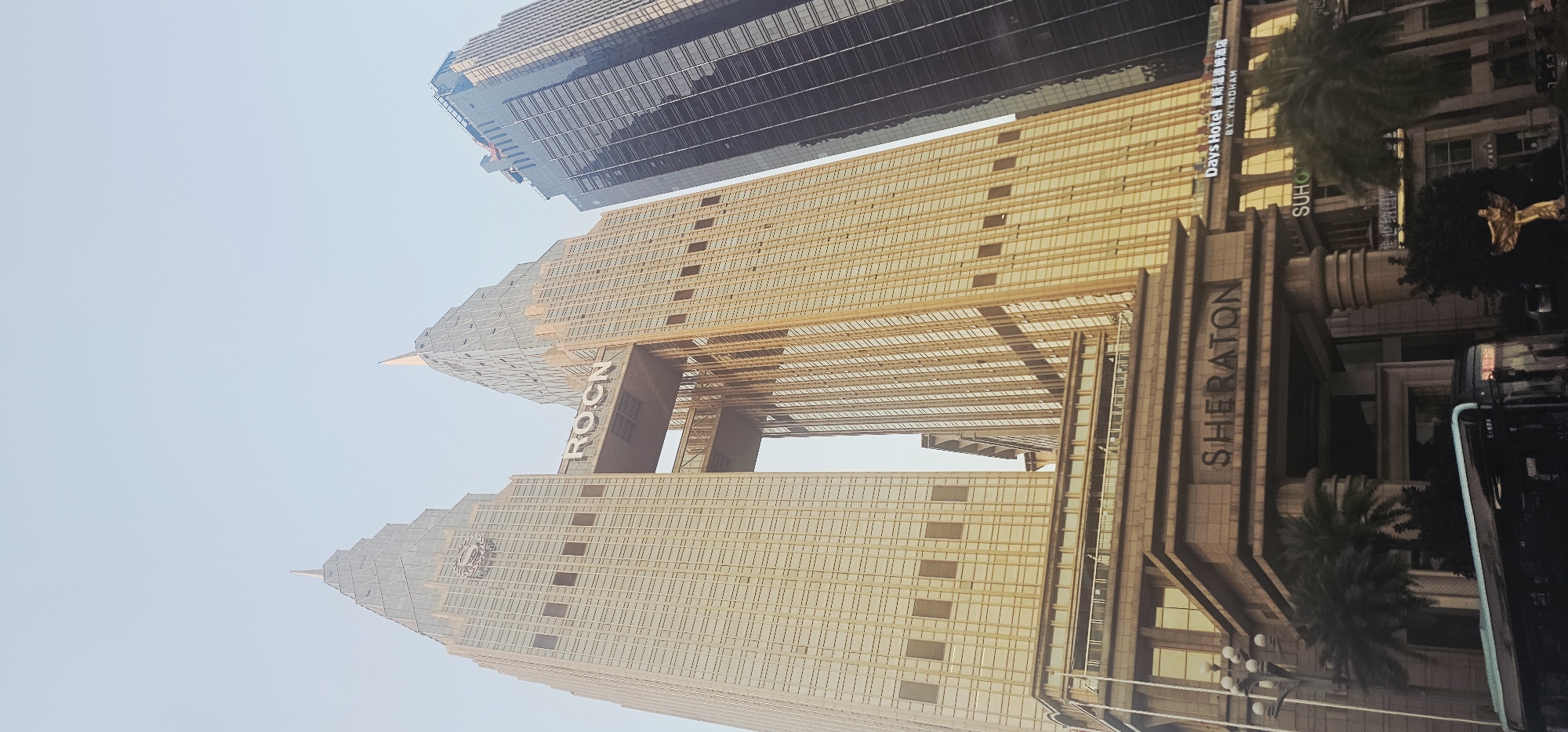 Chongqing's golden Sheraton tower from three street-level angles