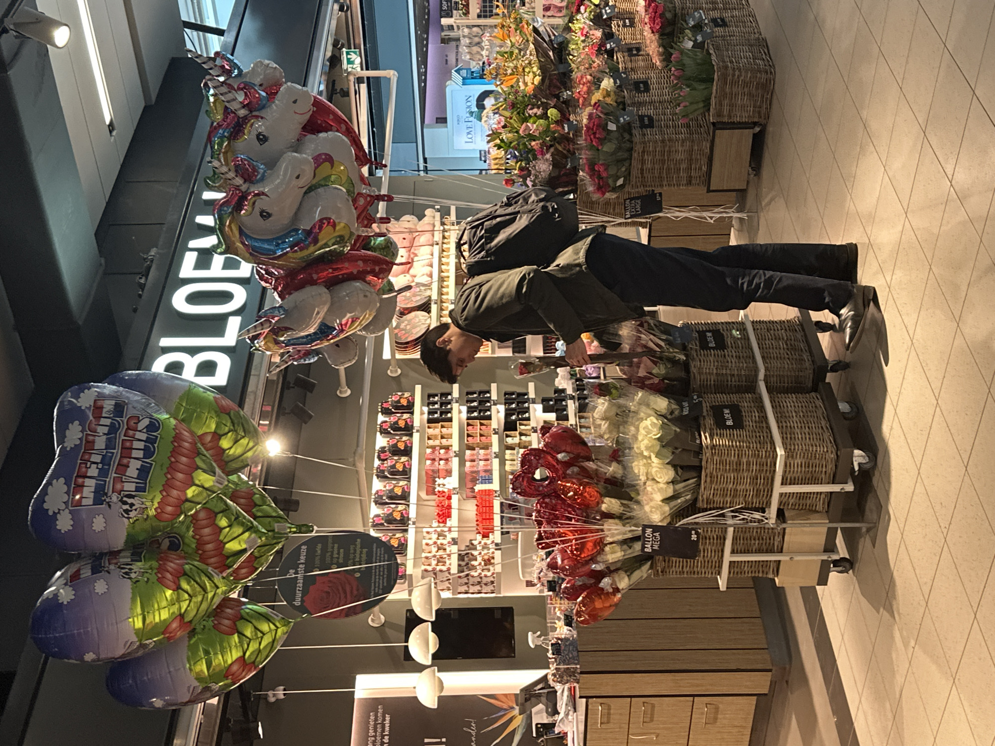 Travelers navigate typical airport activities at Amsterdam Schiphol