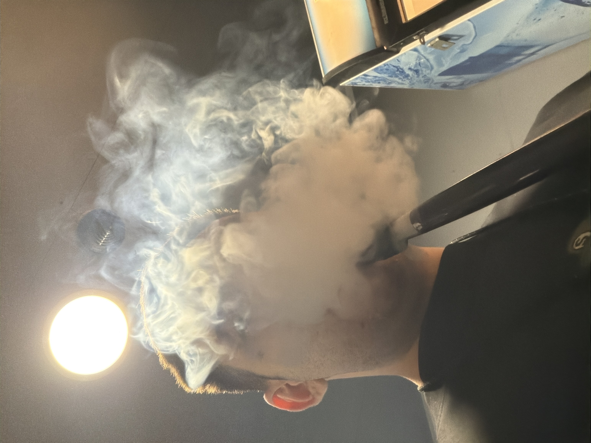 Man vapes in Varna store amid beverage displays