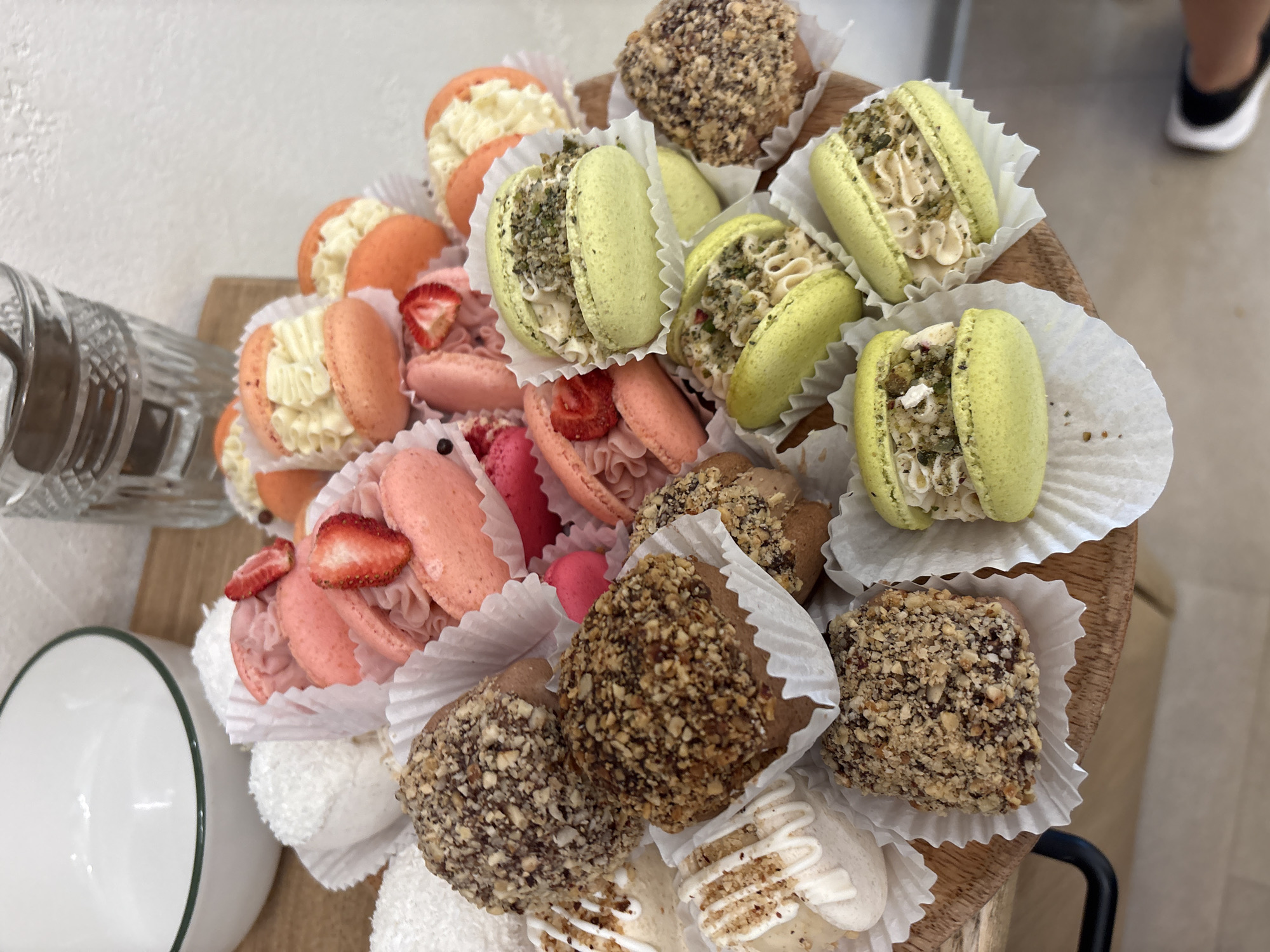 Close-up shots of café goods: macarons, coffee, and chilled drinks