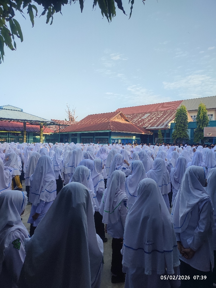 Indonesian school students gather for morning assembly and classes