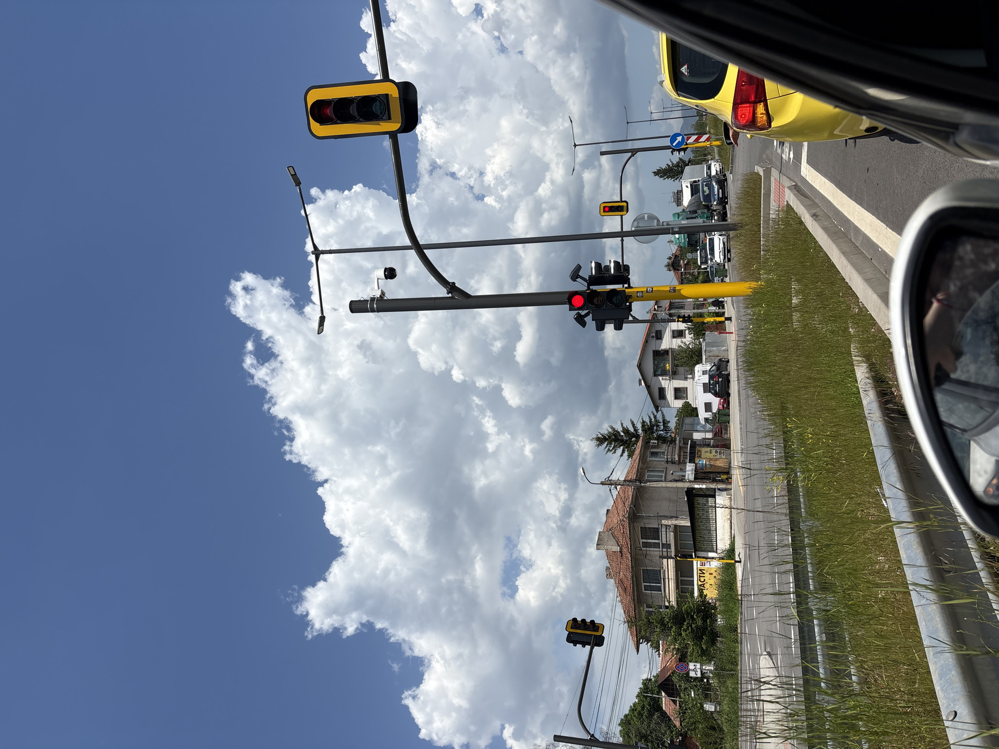 Urban intersection with red traffic lights captured from vehicle