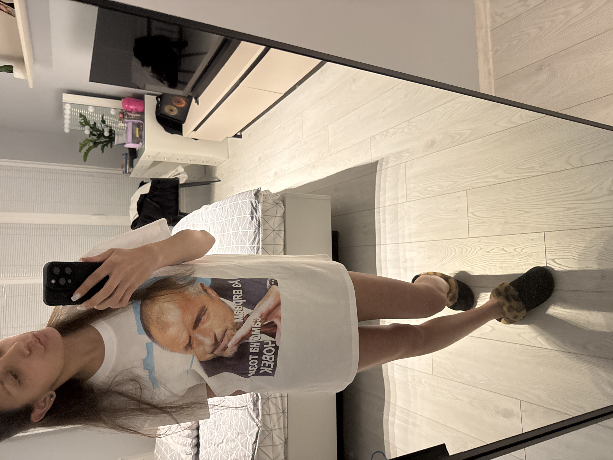 Woman takes mirror selfies in Sofia bedroom
