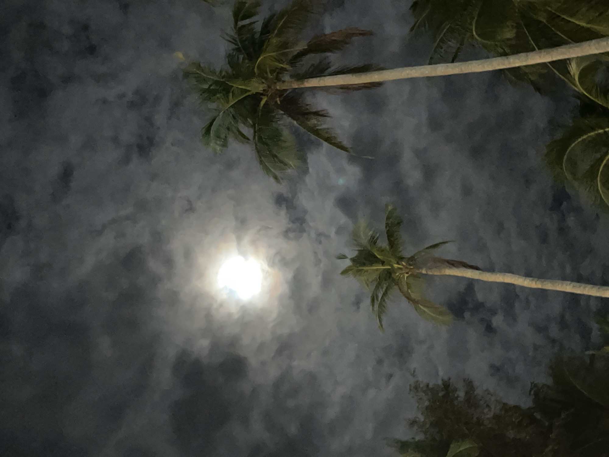 Full moon observed through clouds in Vietnam
