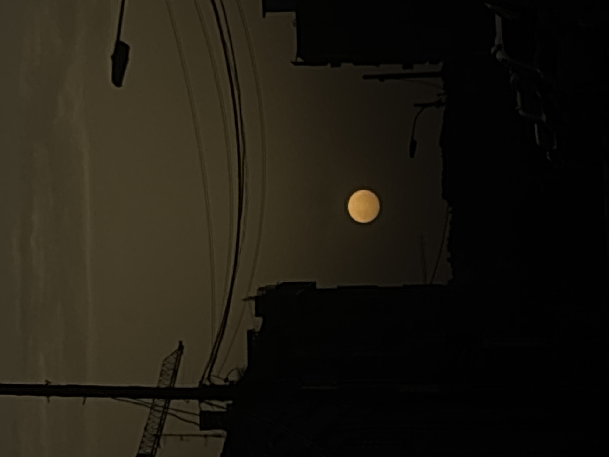 Full moon illuminates night sky over Zaragoza, Spain