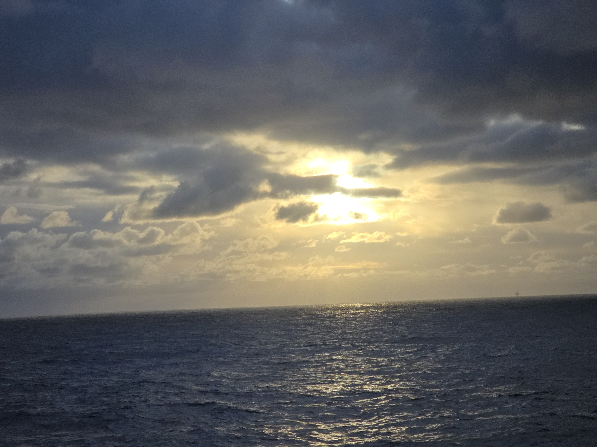 Dramatic sunset breaks through clouds over Norwegian coast