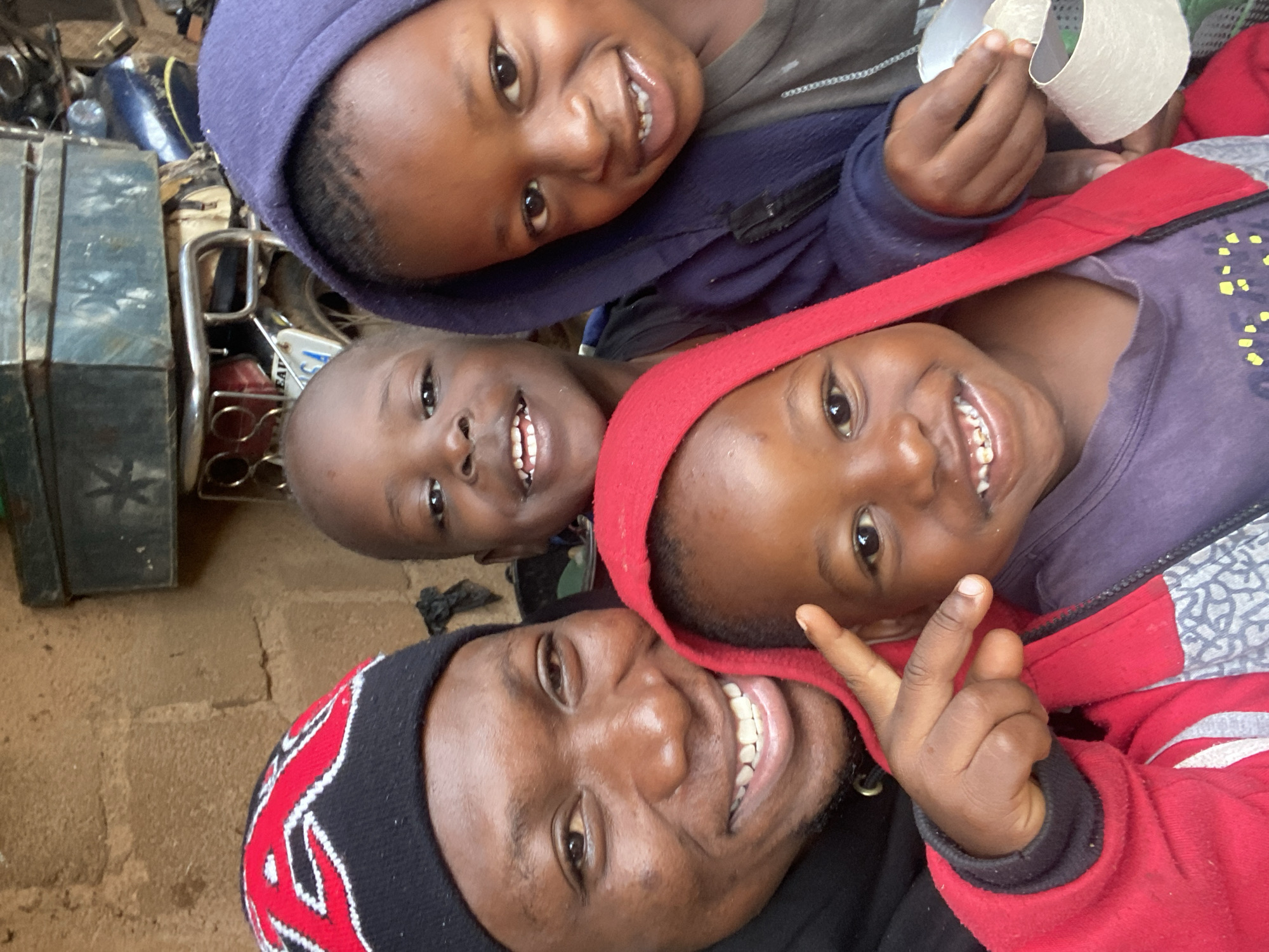 Kids posing and goofing around outside in Jos, Nigeria