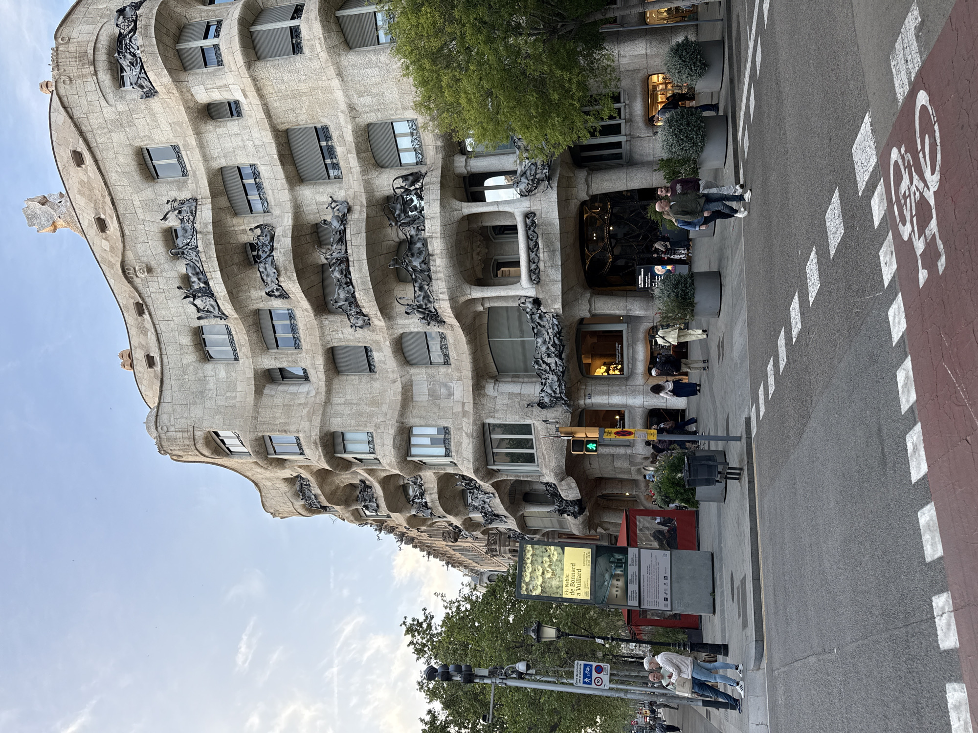 Tourist documents Gaudí's Casa Milà and shopping in Barcelona