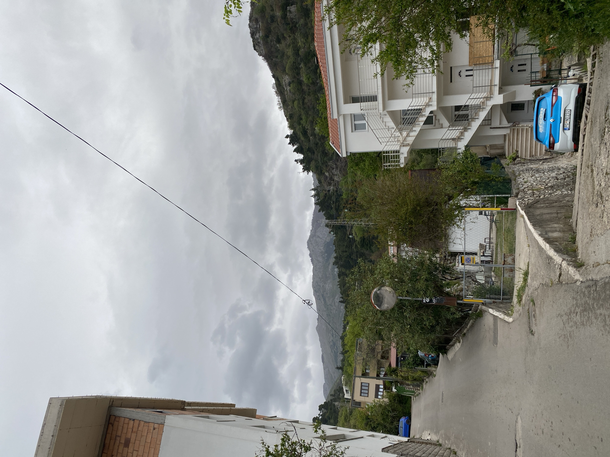 Morning walk through rainy Budva captures spring blooms, streets