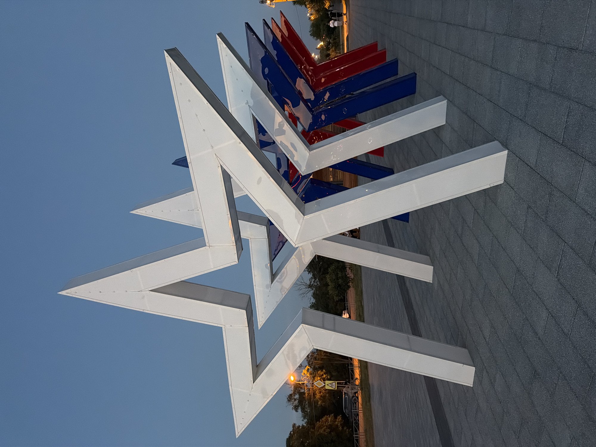 Metallic star sculptures at dusk in Budyonnovsk, Russia