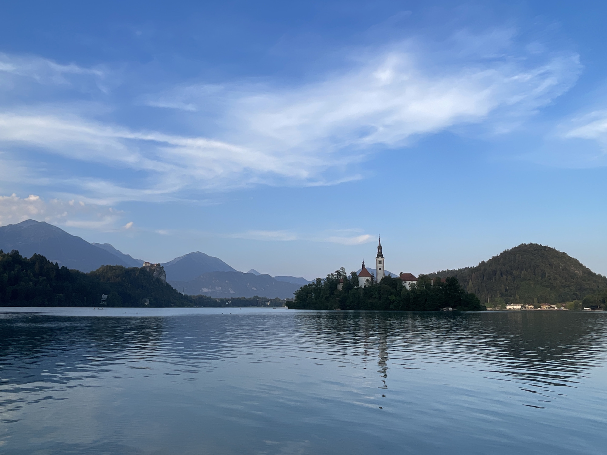 Peaceful lake views with a church island on the horizon