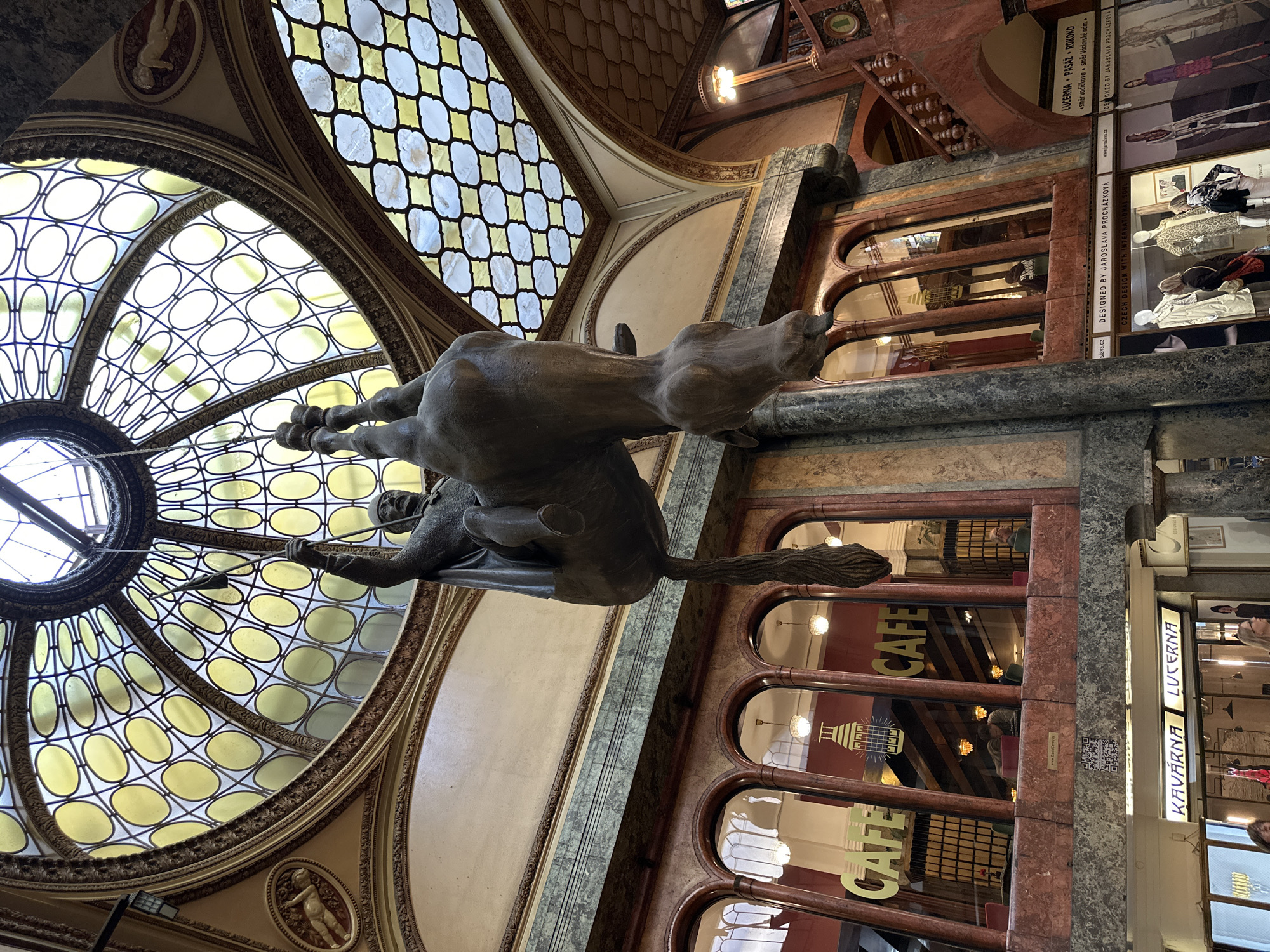 Černý's inverted horse sculpture observed at Prague's Lucerna Palace