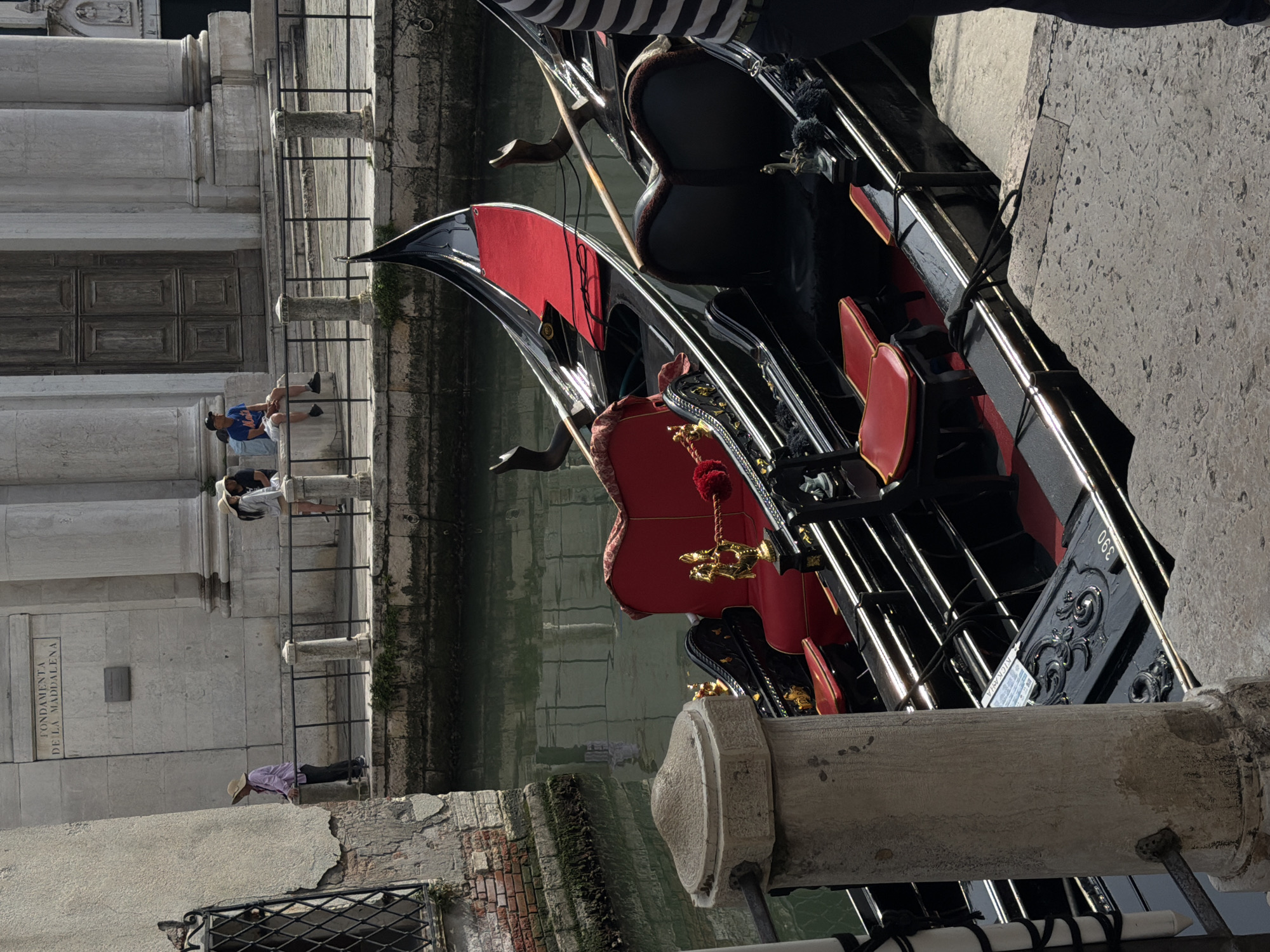 Venice canal walk with gondolas and classic architecture