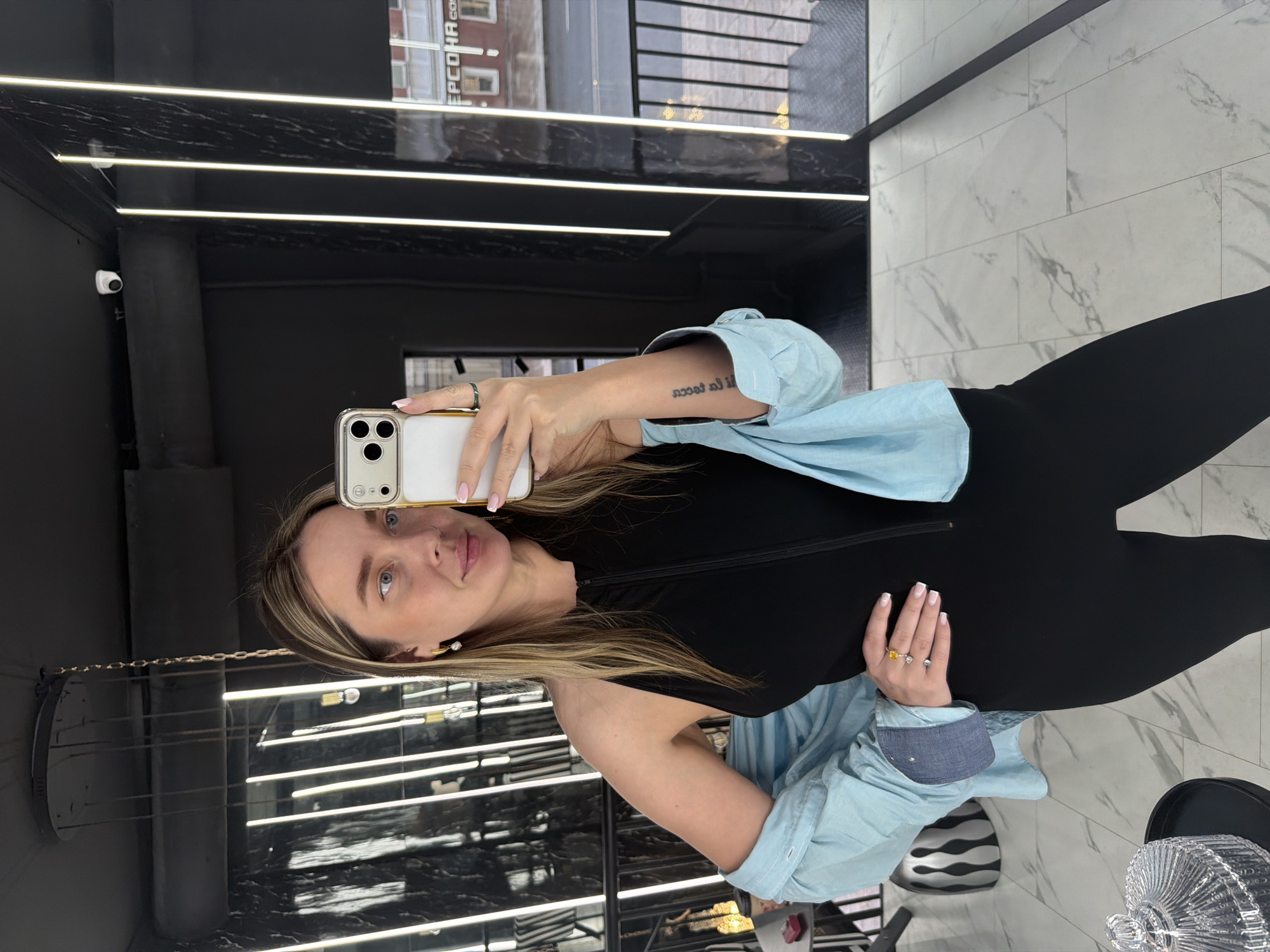 Woman photographed taking selfies in Moscow retail space