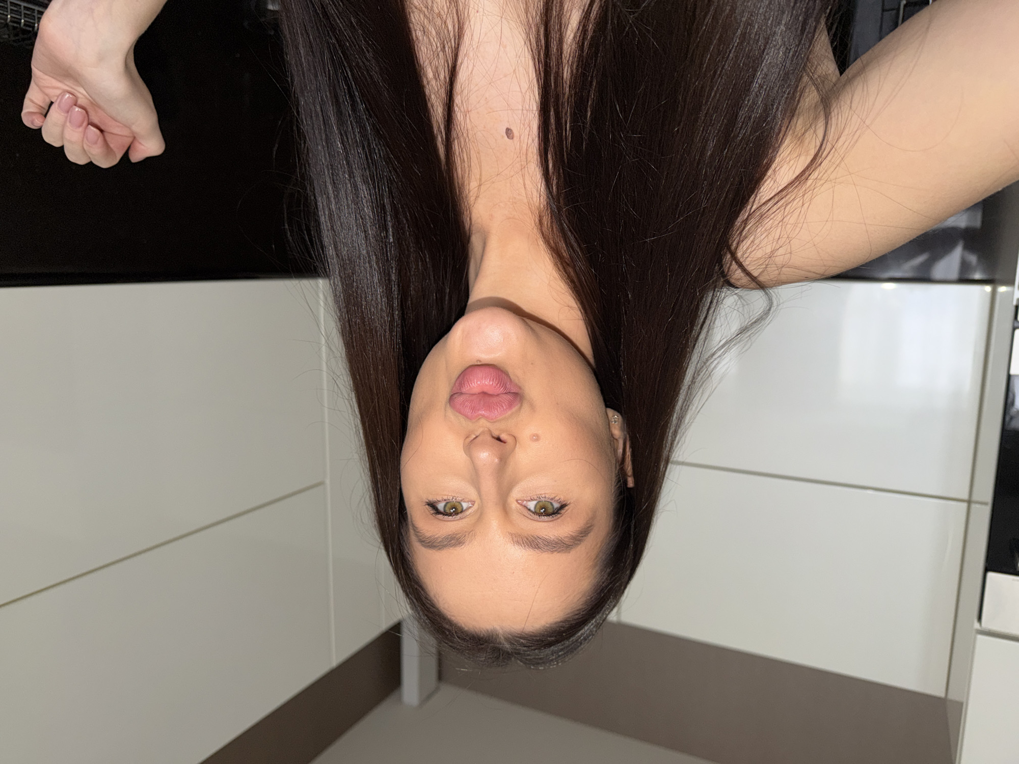 Woman takes mirror selfies in Khimki apartment