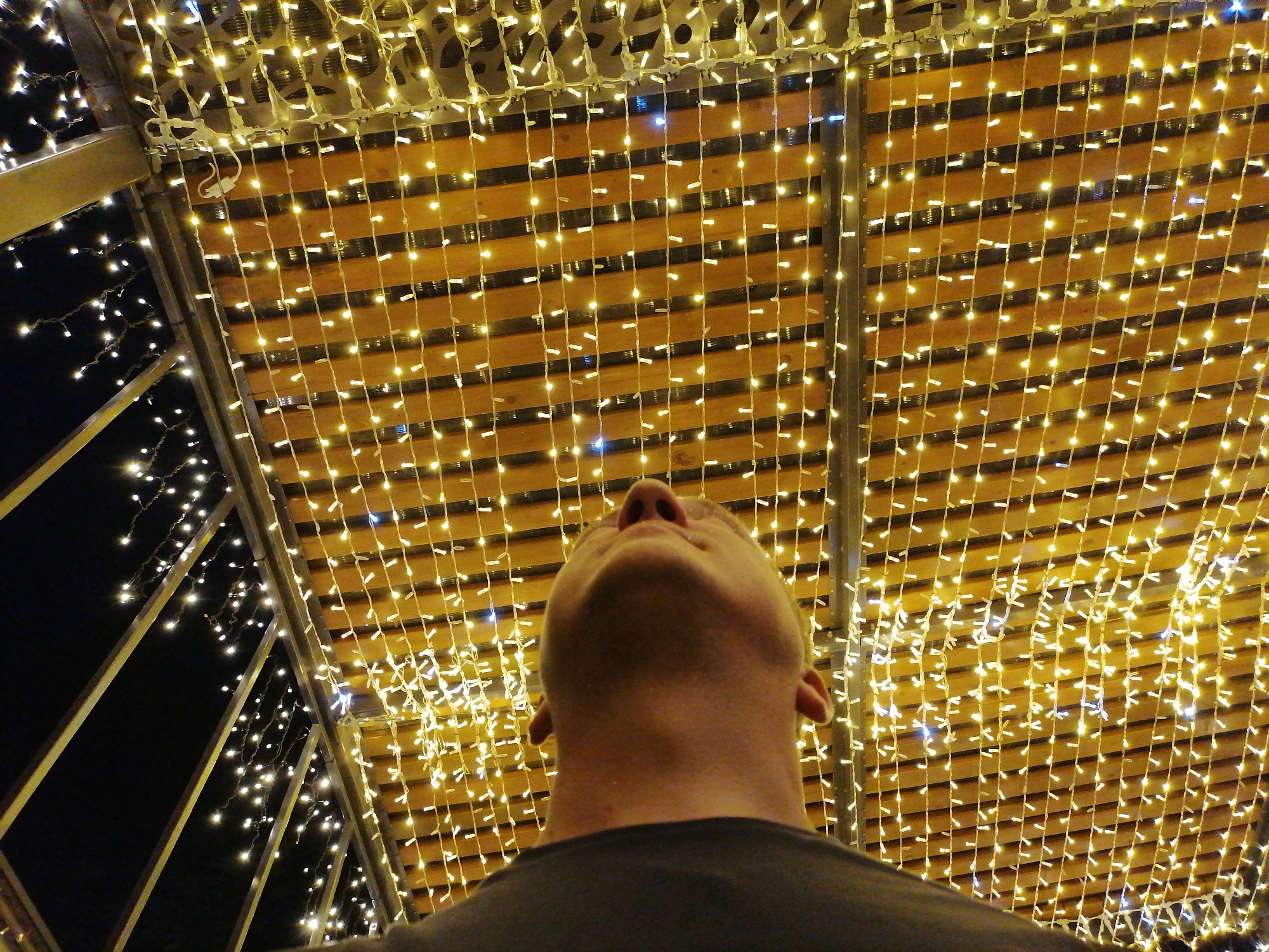 Evening drinks and string lights at a warmly lit venue