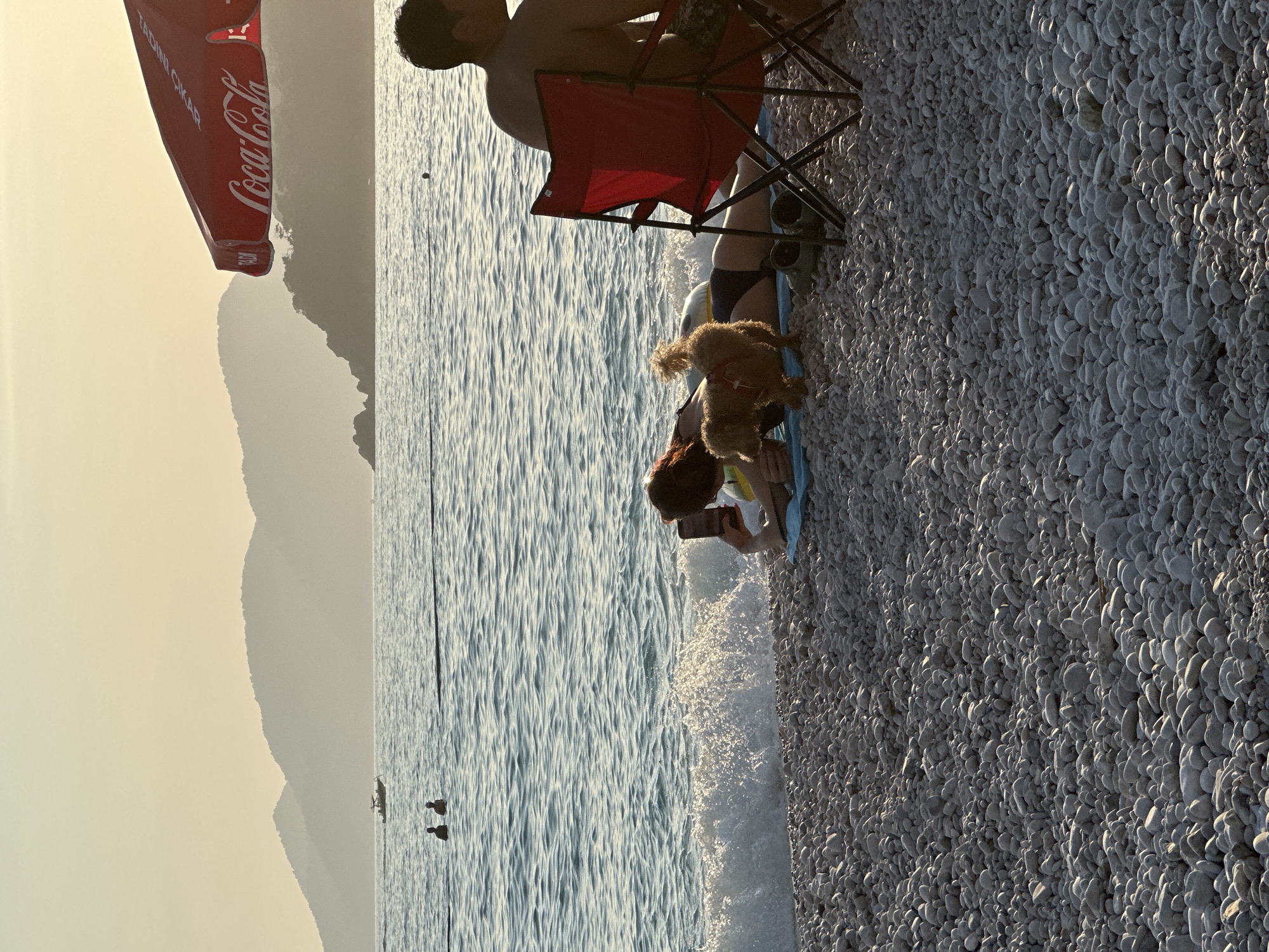 Families enjoy late afternoon at Fethiye beach, Turkey