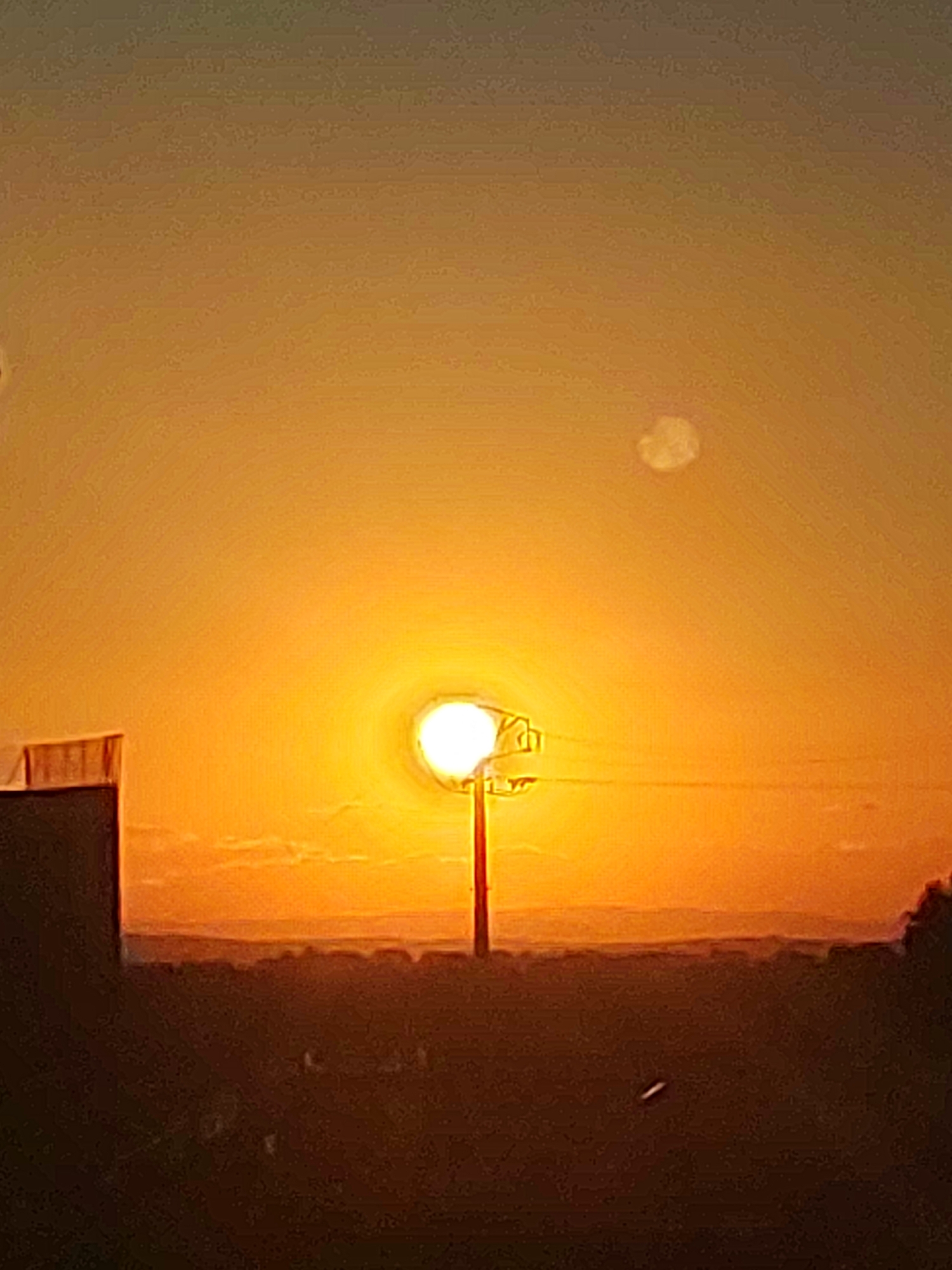 Golden sunset colors the sky over Sobradillo, Spain