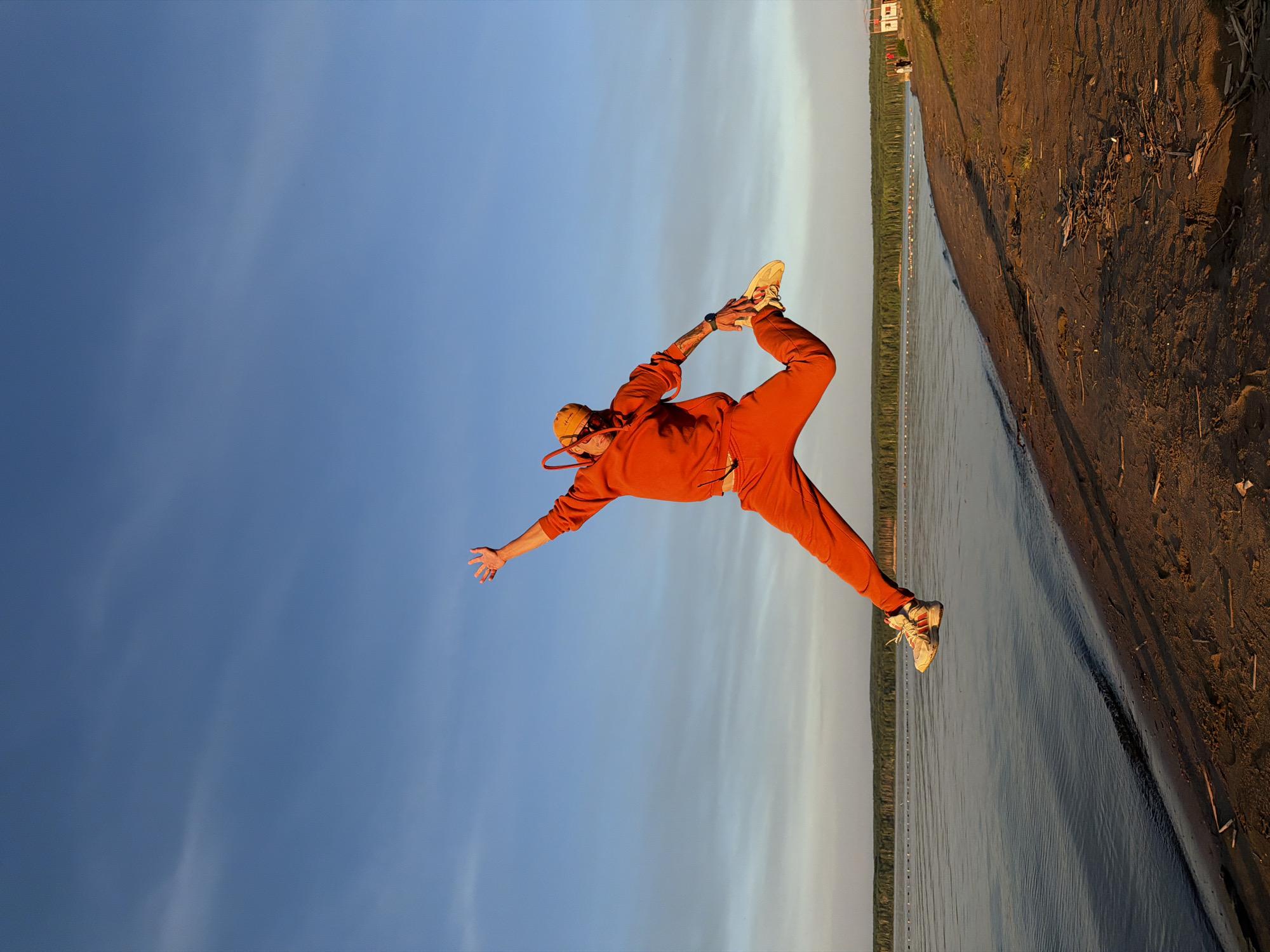 Sunset yoga session captured along Chaikovsky riverbank