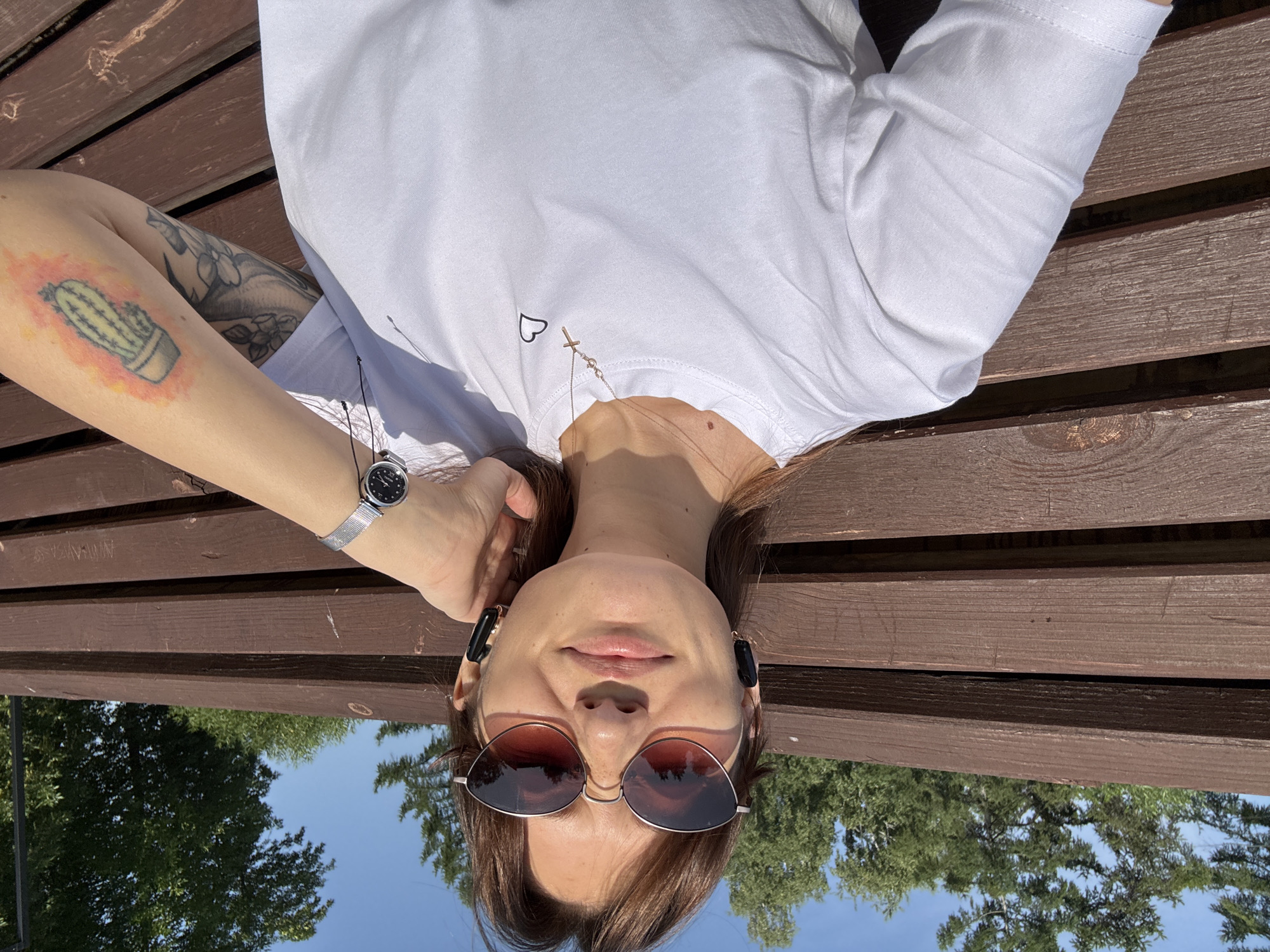 Relaxing on a bench outdoors on a sunny day in Novokuznetsk