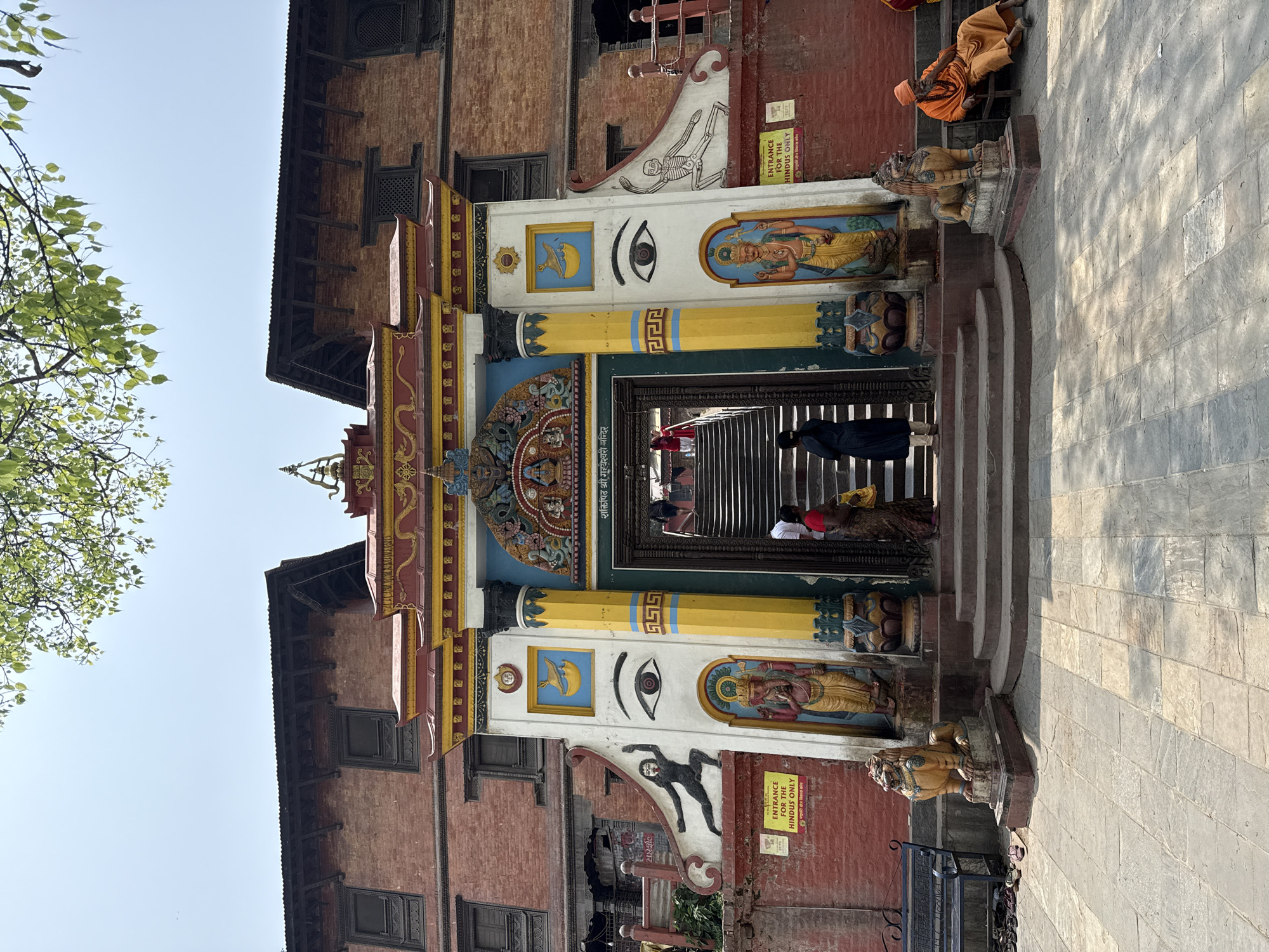 Temple entrance with ornate carvings documented in Kathmandu
