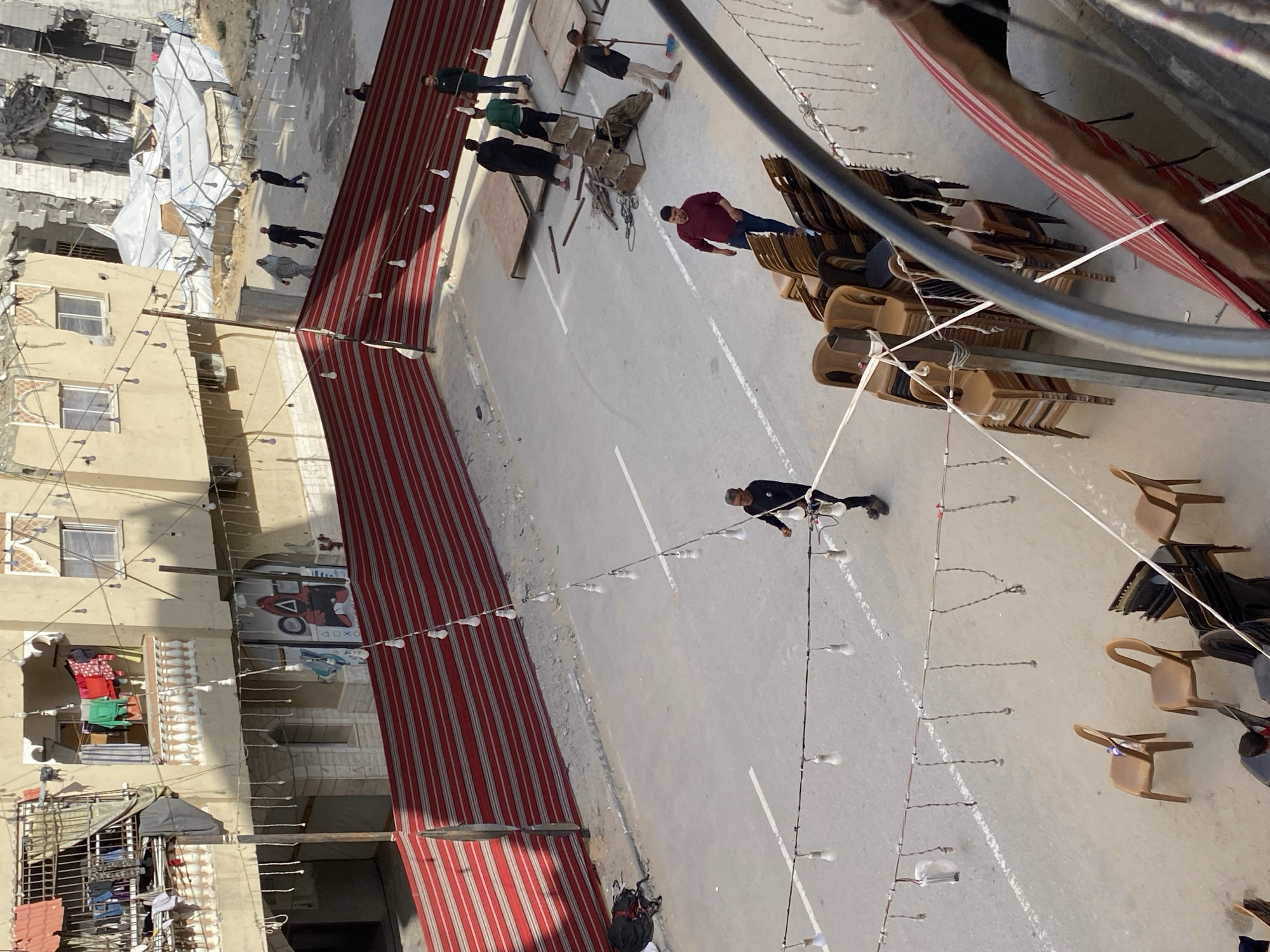 Community gathering documented in Khan Yunis street scene