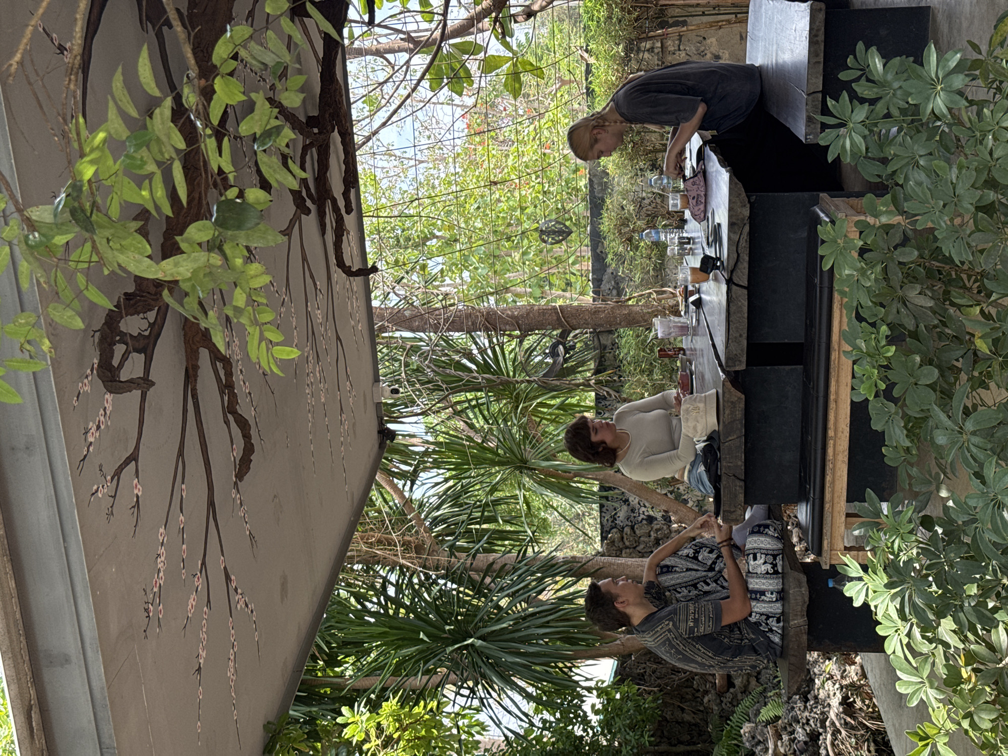 Young adults enjoy early morning breakfast at Thai cafe