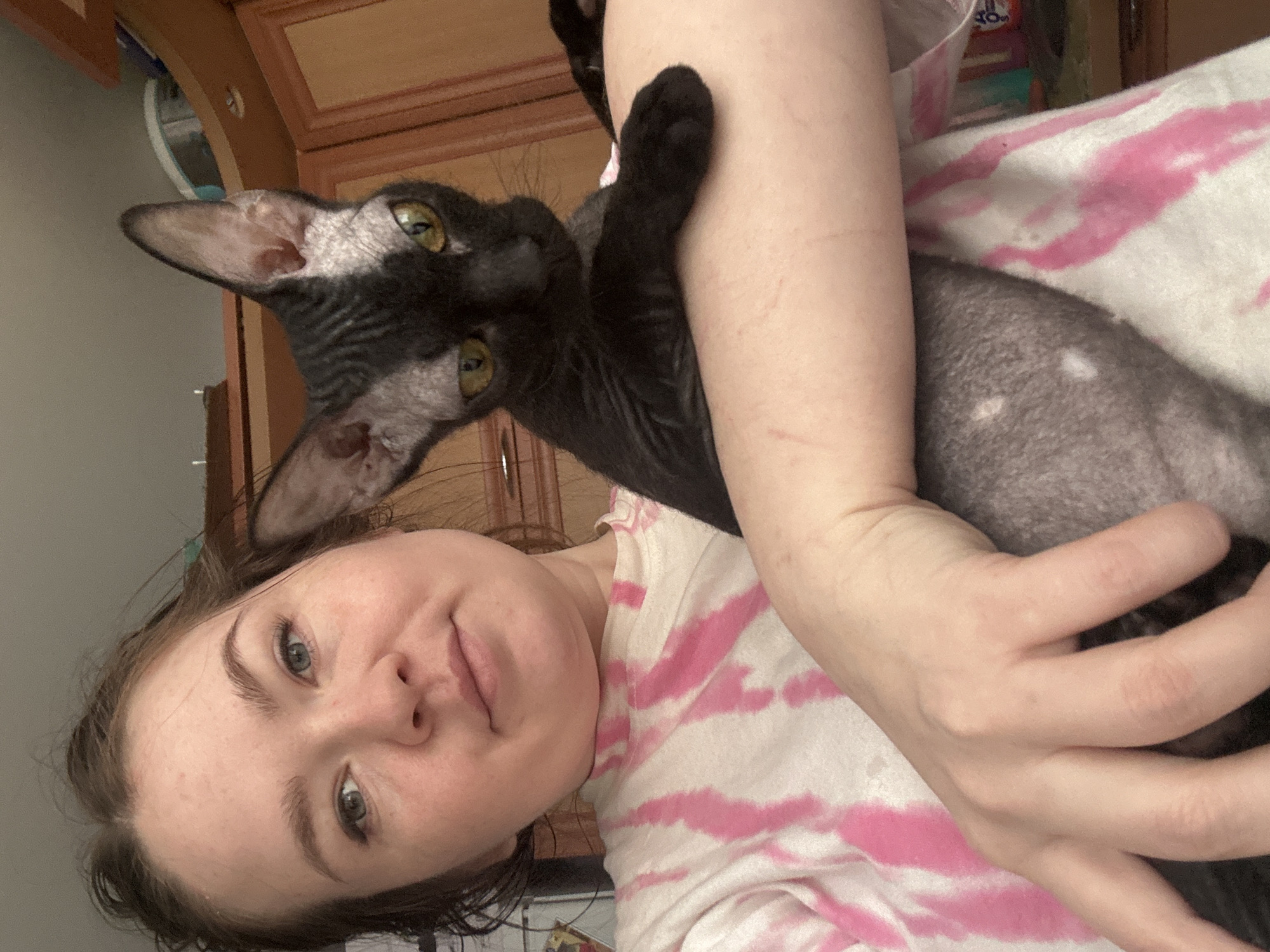 Woman and cat documented in early morning Chaikovsky scenes