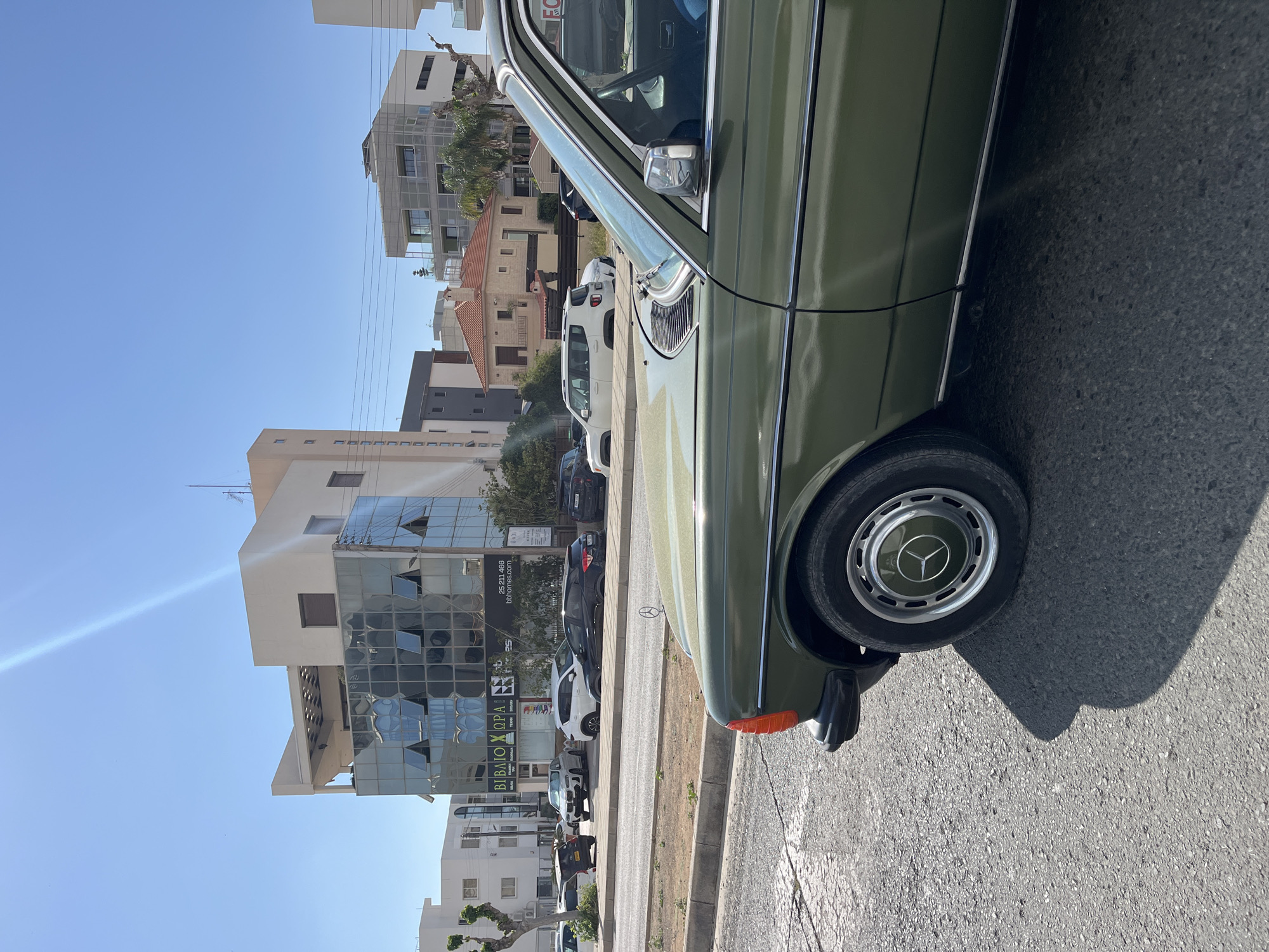 Green Mercedes W123 spotted parked on Limassol street