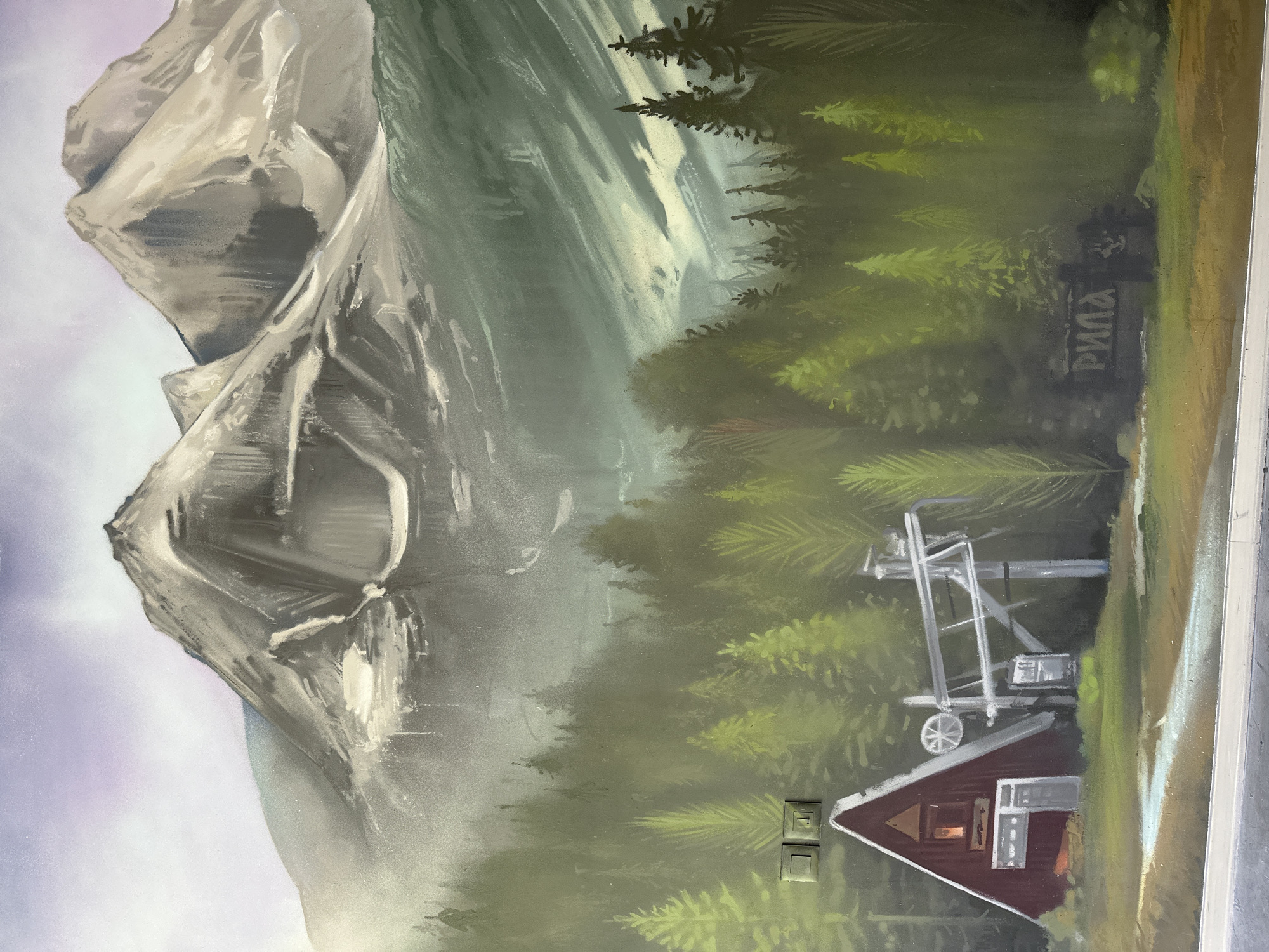 Mountain mural and forest road documented in same location