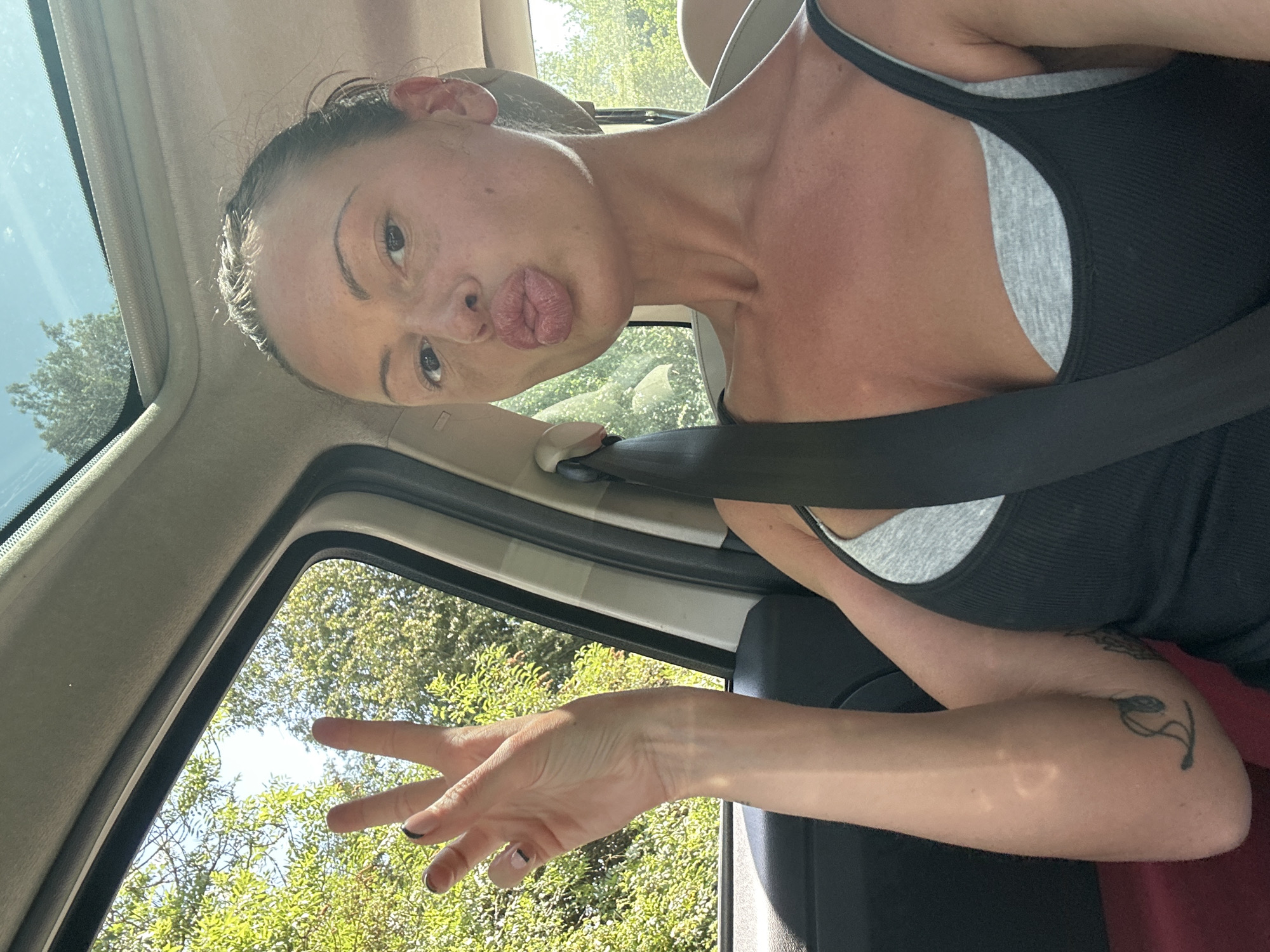 Woman takes selfie in car in Tunbridge Wells