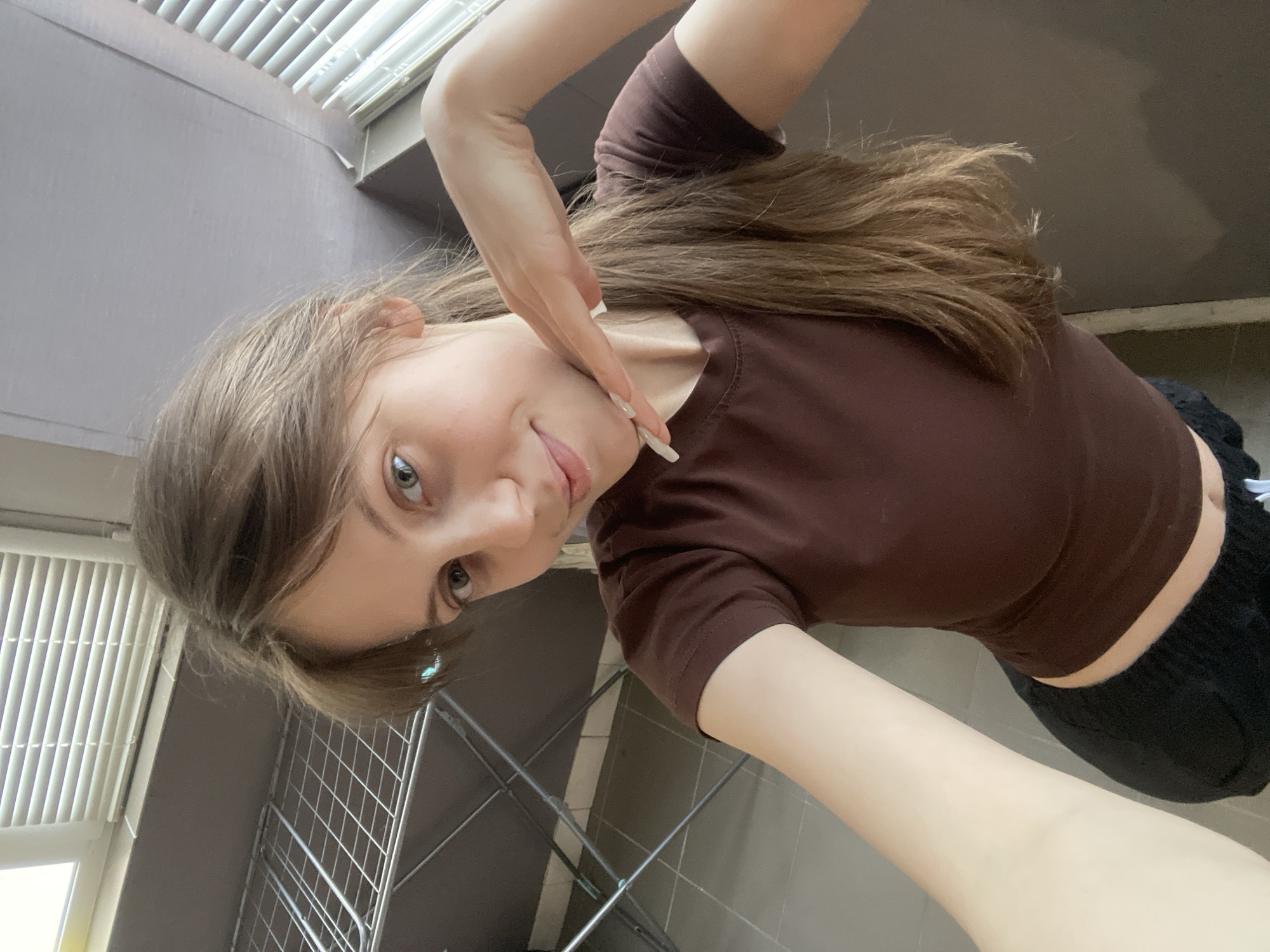 Woman takes selfies during casual afternoon in Ufa
