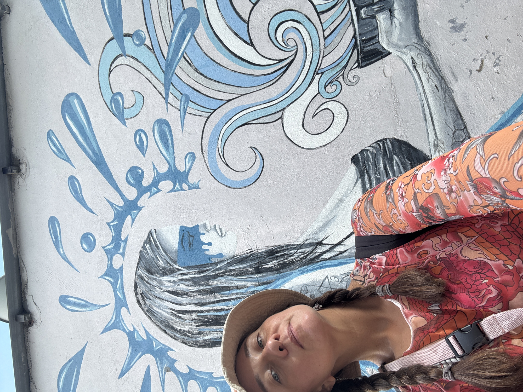 Nha Trang coastal morning: boats, murals, and beachfront life