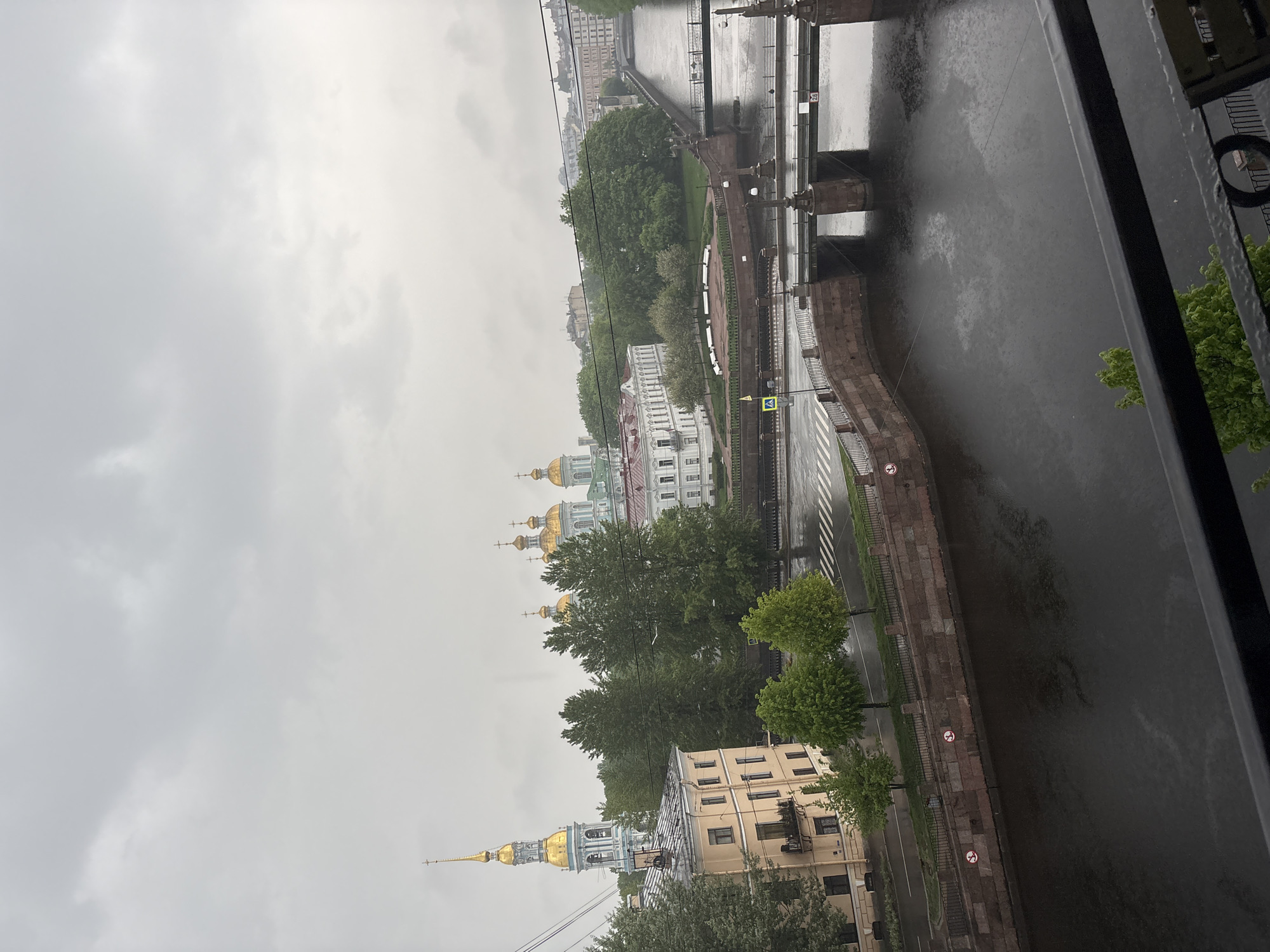 Woman documents morning routine amid overcast Saint Petersburg dawn
