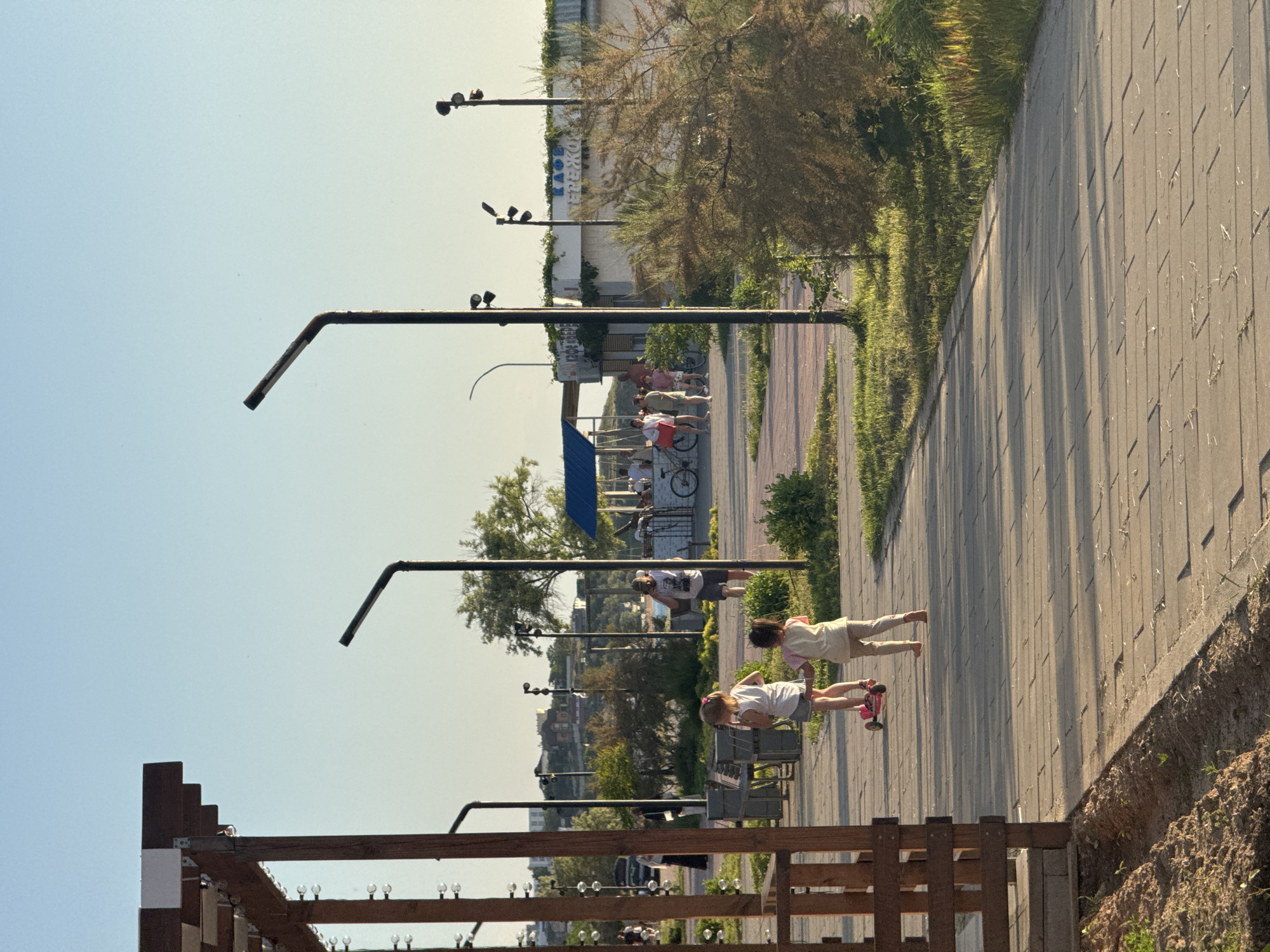 Afternoon stroll captured along Shcholkino waterfront promenade