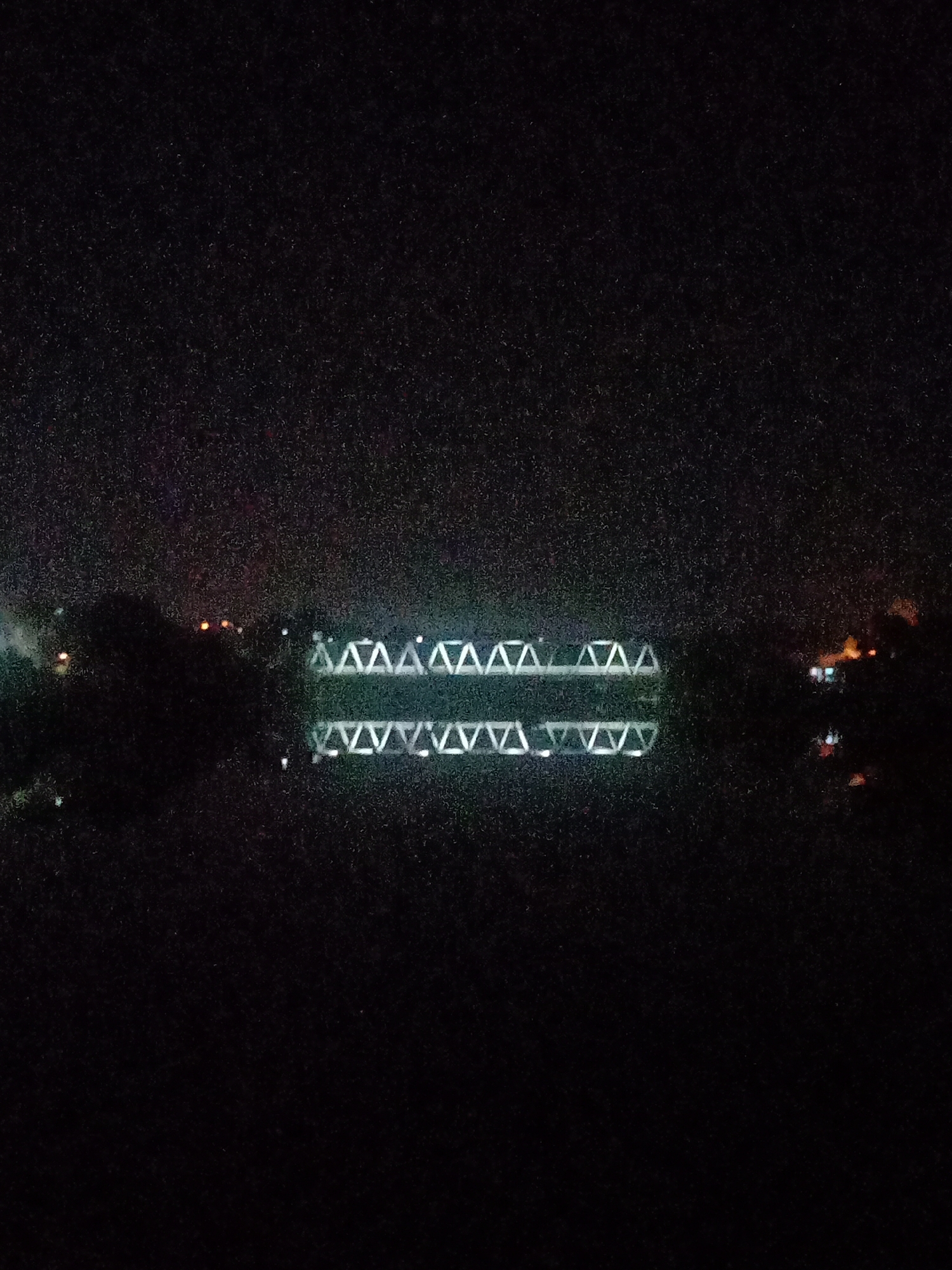 Illuminated Bridge Captures Peaceful Night Scene in Lhokseumawe