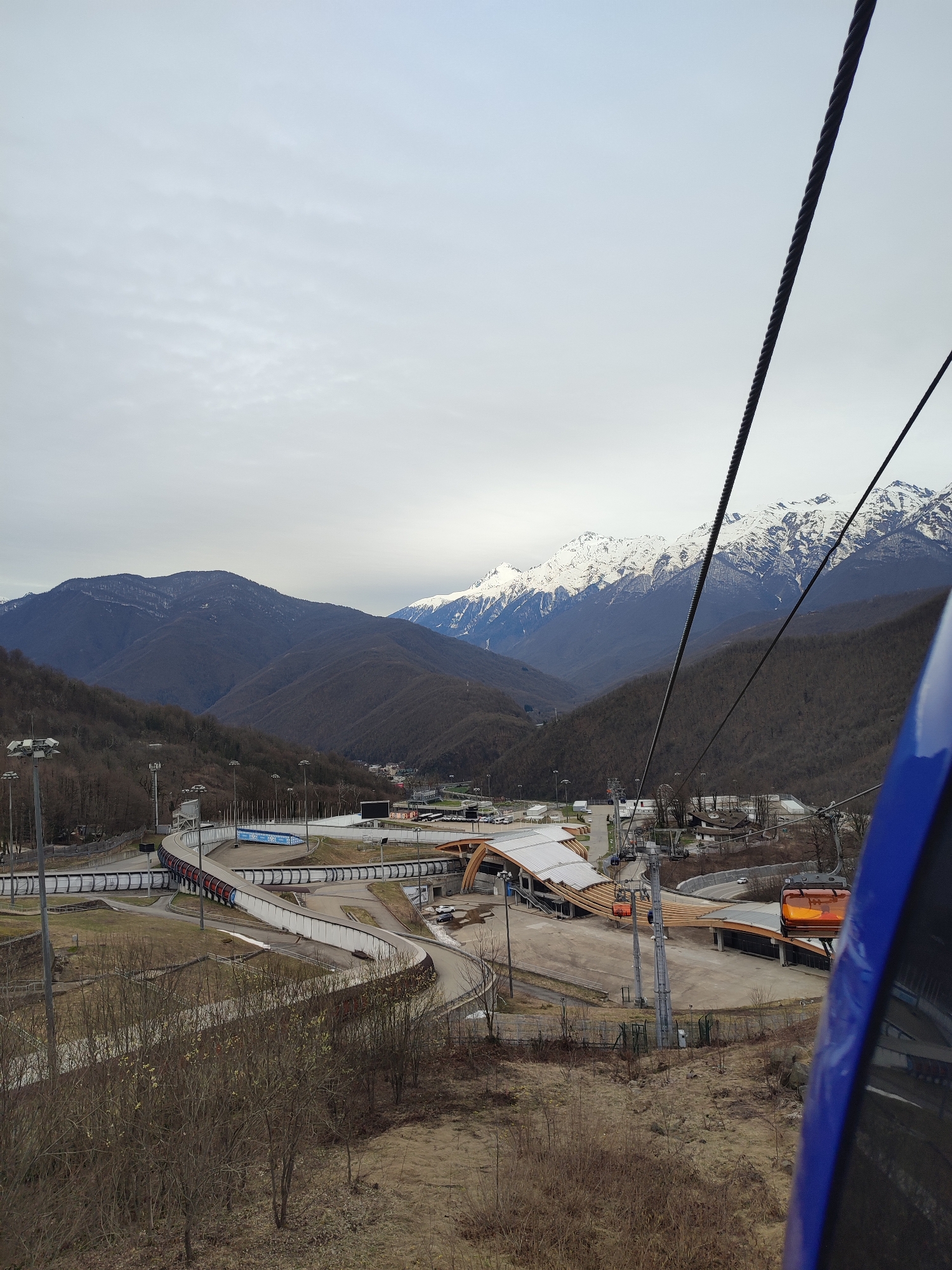 Ski lift view shows bobsled track in Sochi valley