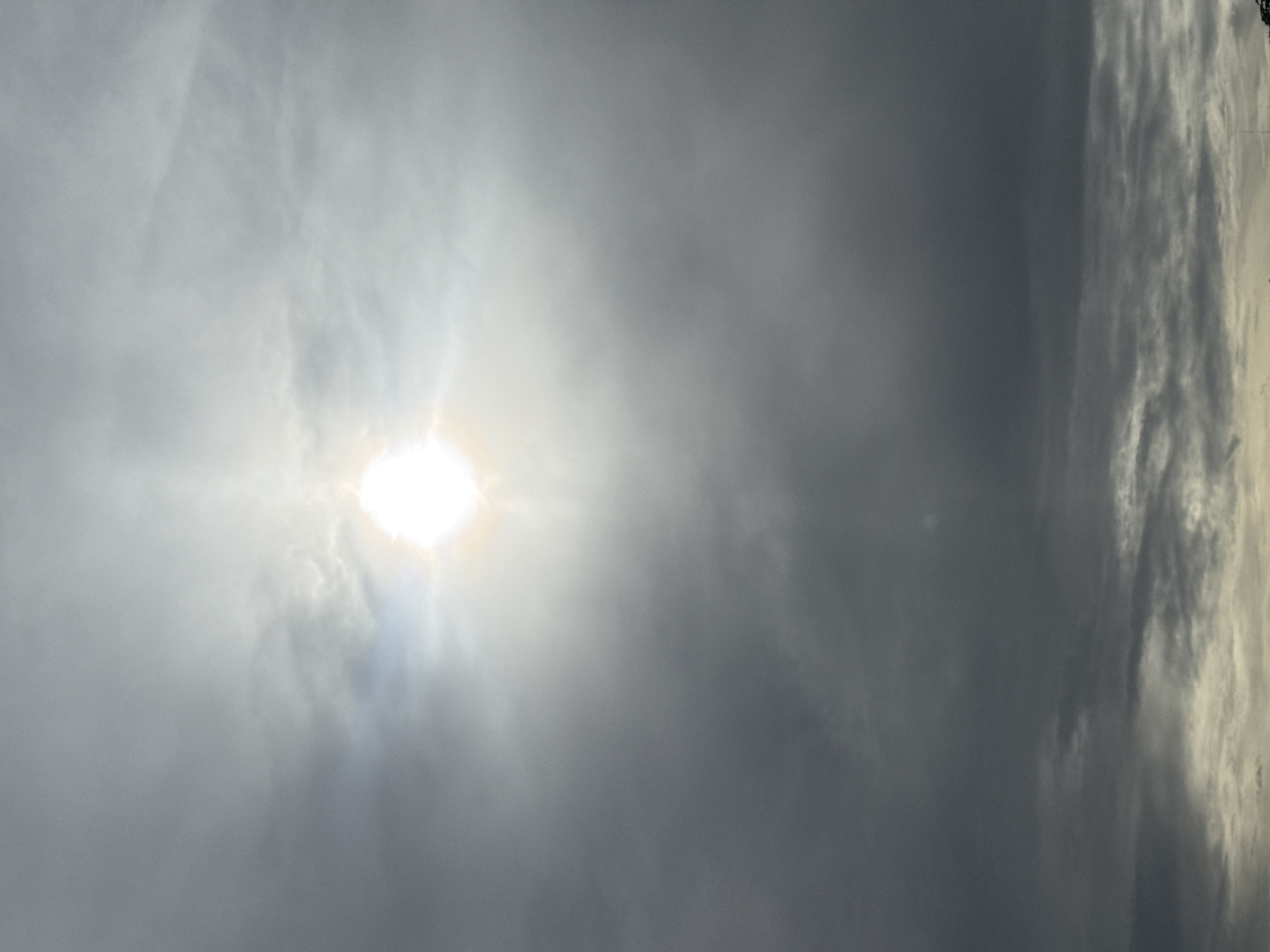 Solar halos and dramatic cloud light on an overcast morning