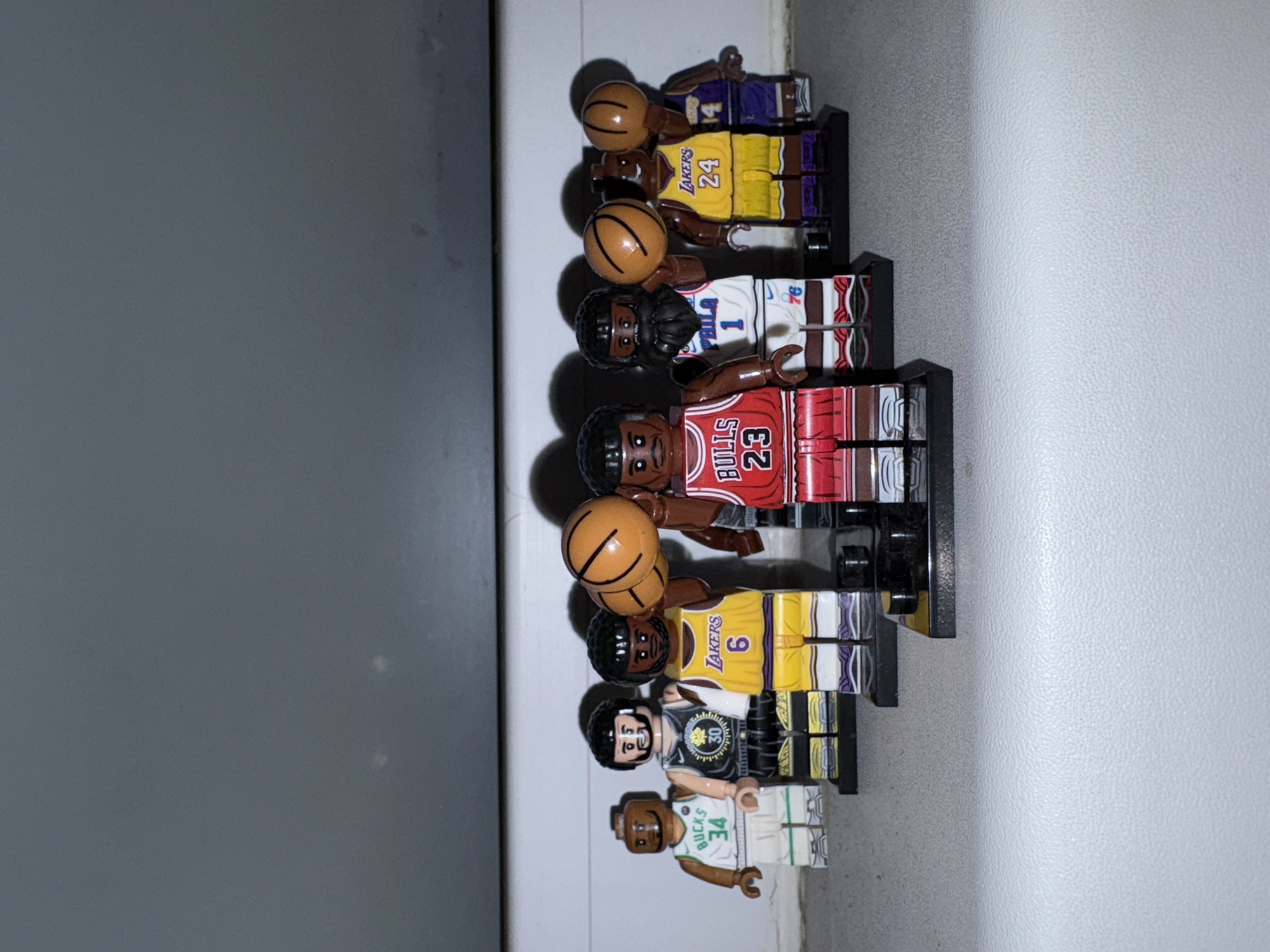 LEGO NBA player collection displayed on windowsill in Izhevsk