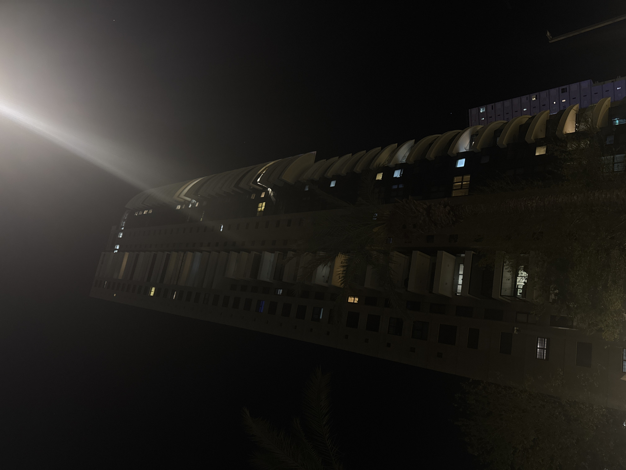 Night photography captures Bat Yam residential buildings with distinctive architecture