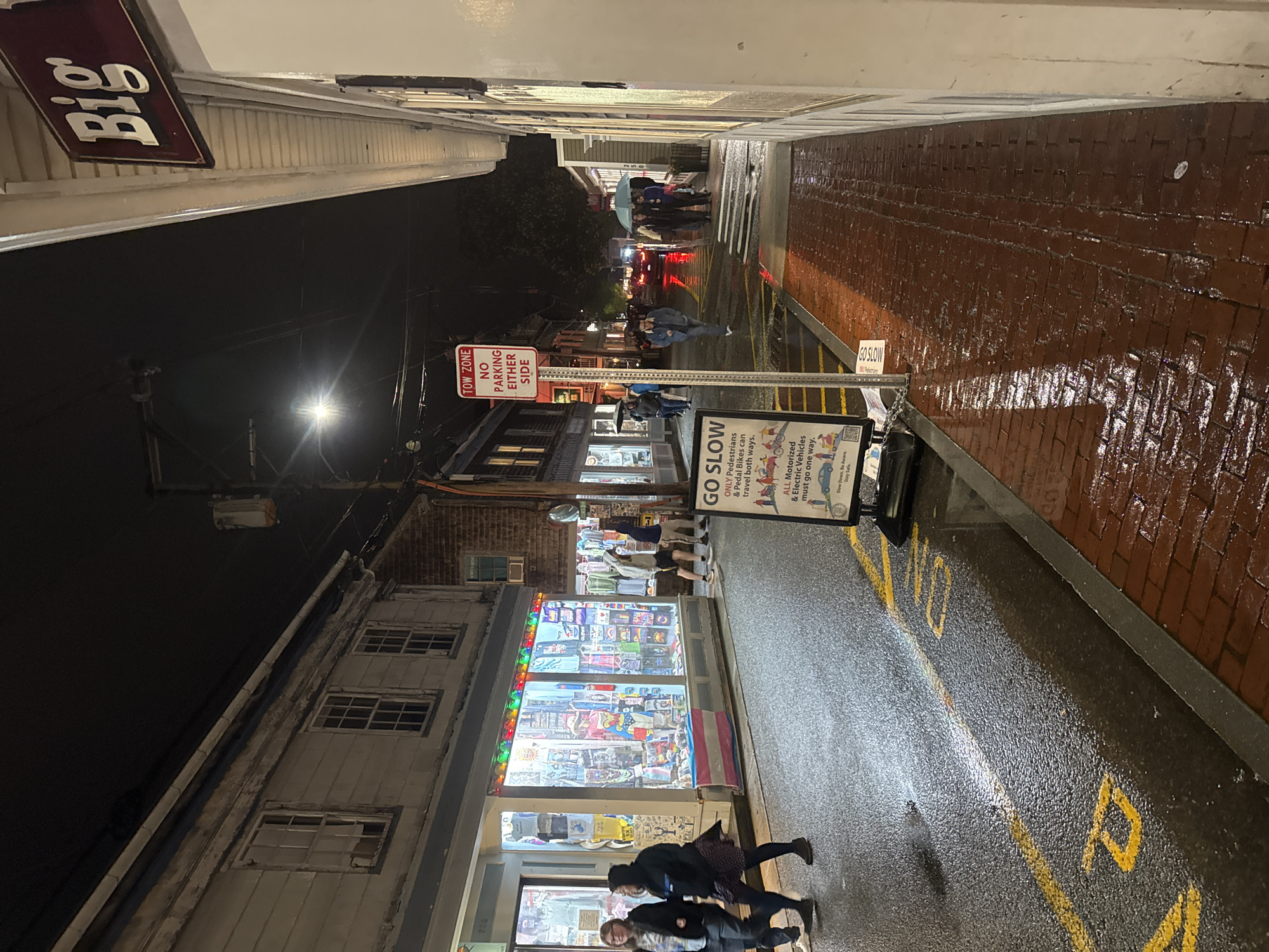 Rainy night scene captured on Provincetown's wet brick streets