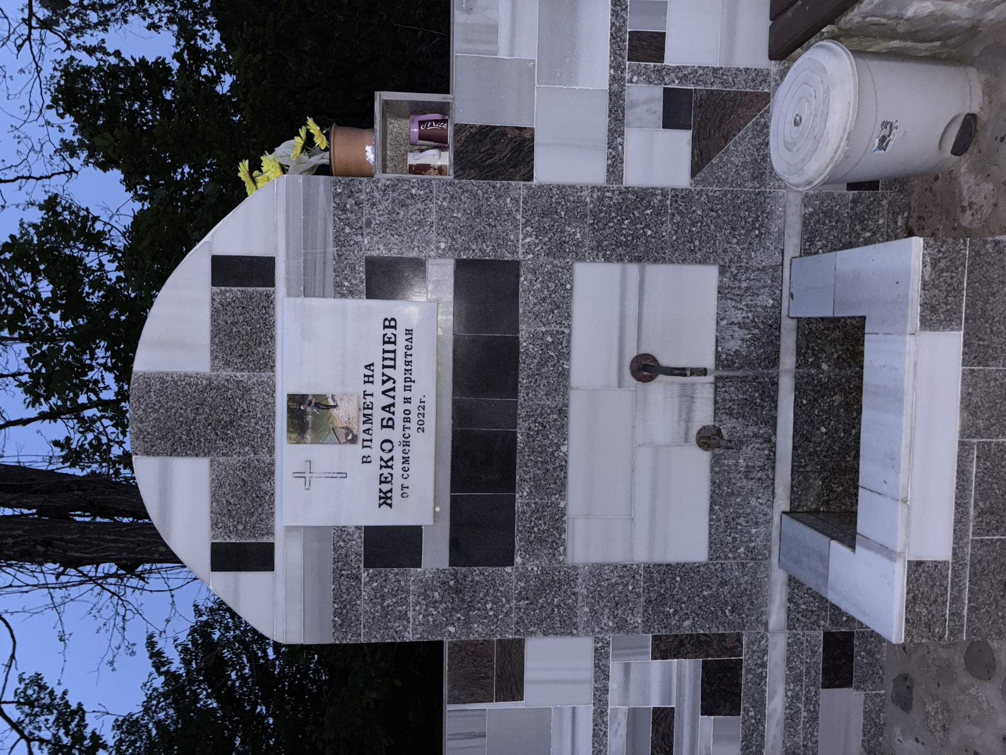 Memorial visit documented in Alamovtsi cemetery at dusk