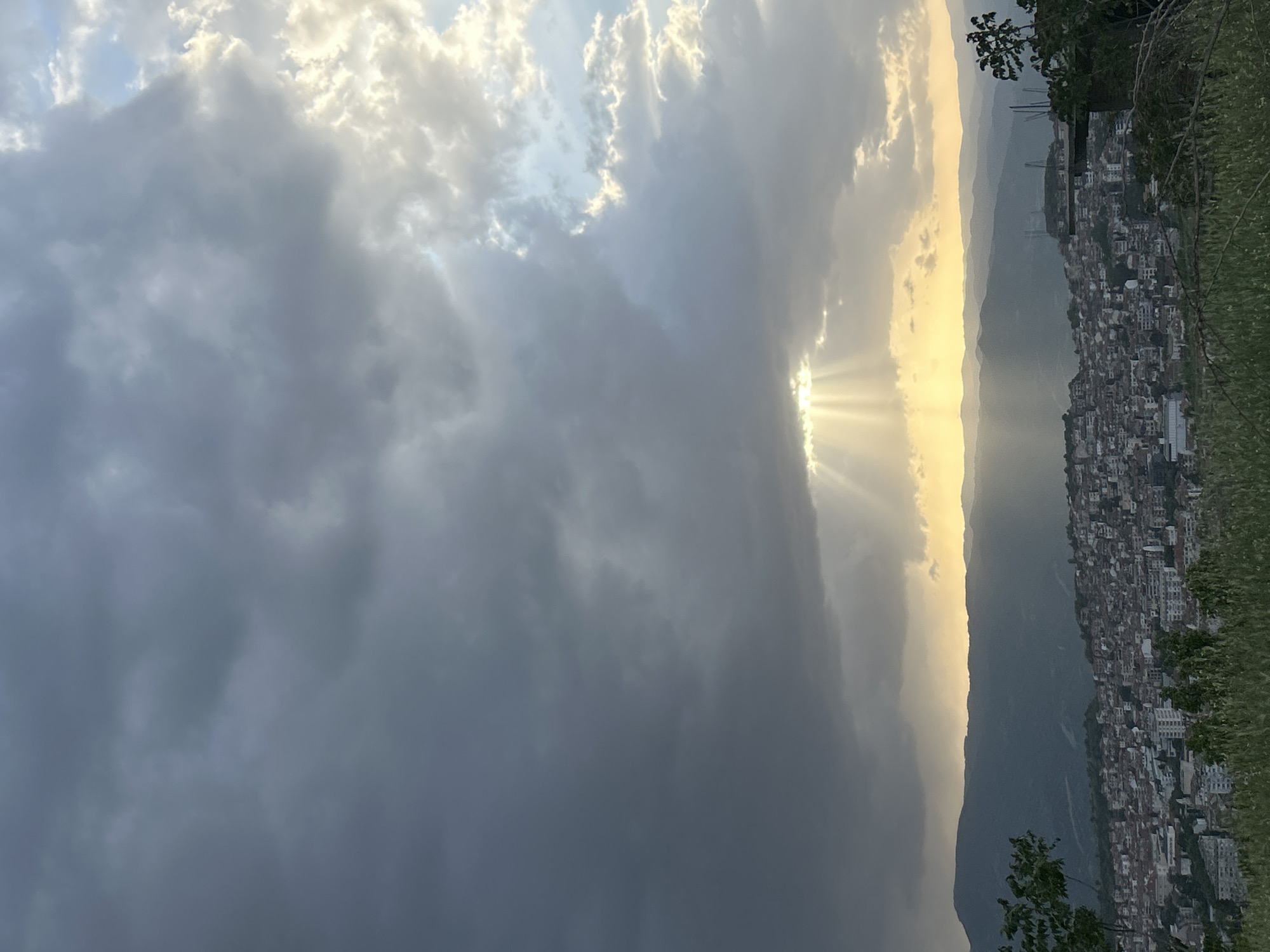 Storm clouds gather over Polenitsa, Bulgaria hillside city