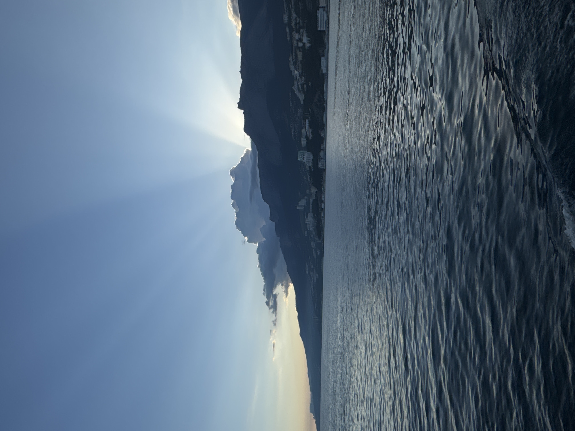 Sunlight through mountains captured in Ukrainian coastal village