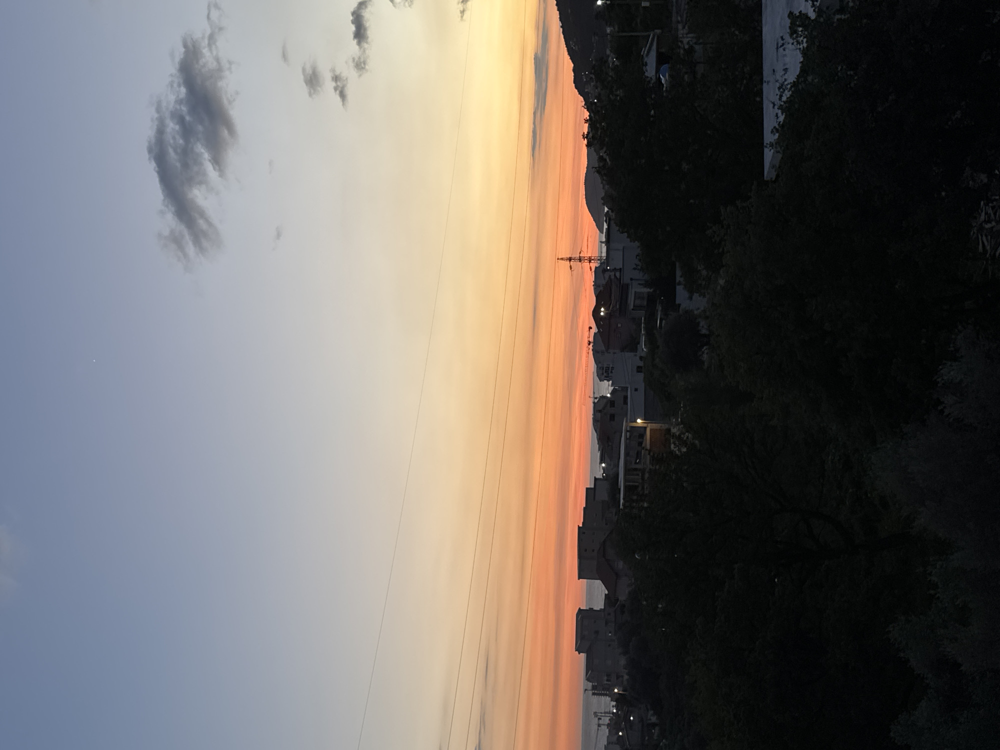 Sunset observed over Sustaš, Montenegro with electricity pylon silhouette