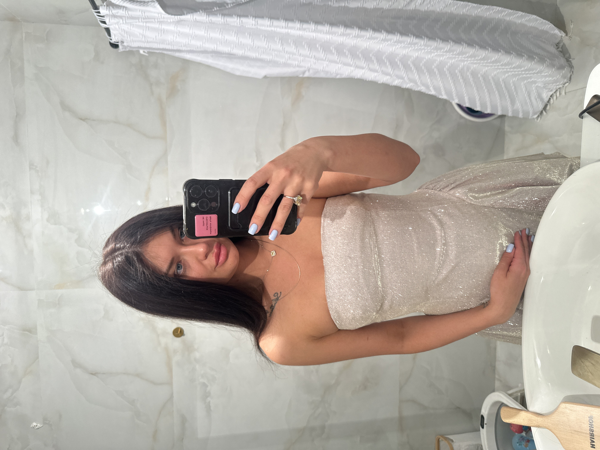 Woman takes rotated mirror selfie in Krasnogorsk bathroom